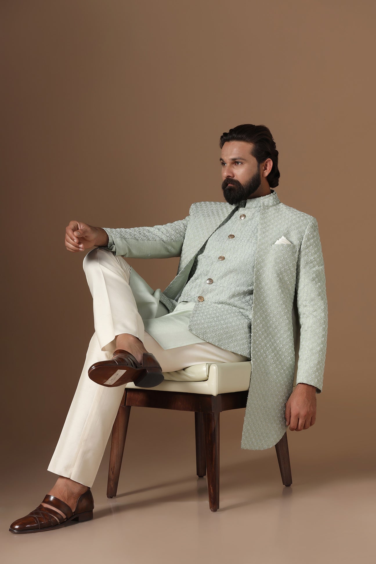 This pistachio green Indowestern is highlighted with overall embroidery across the body. Shop Now!