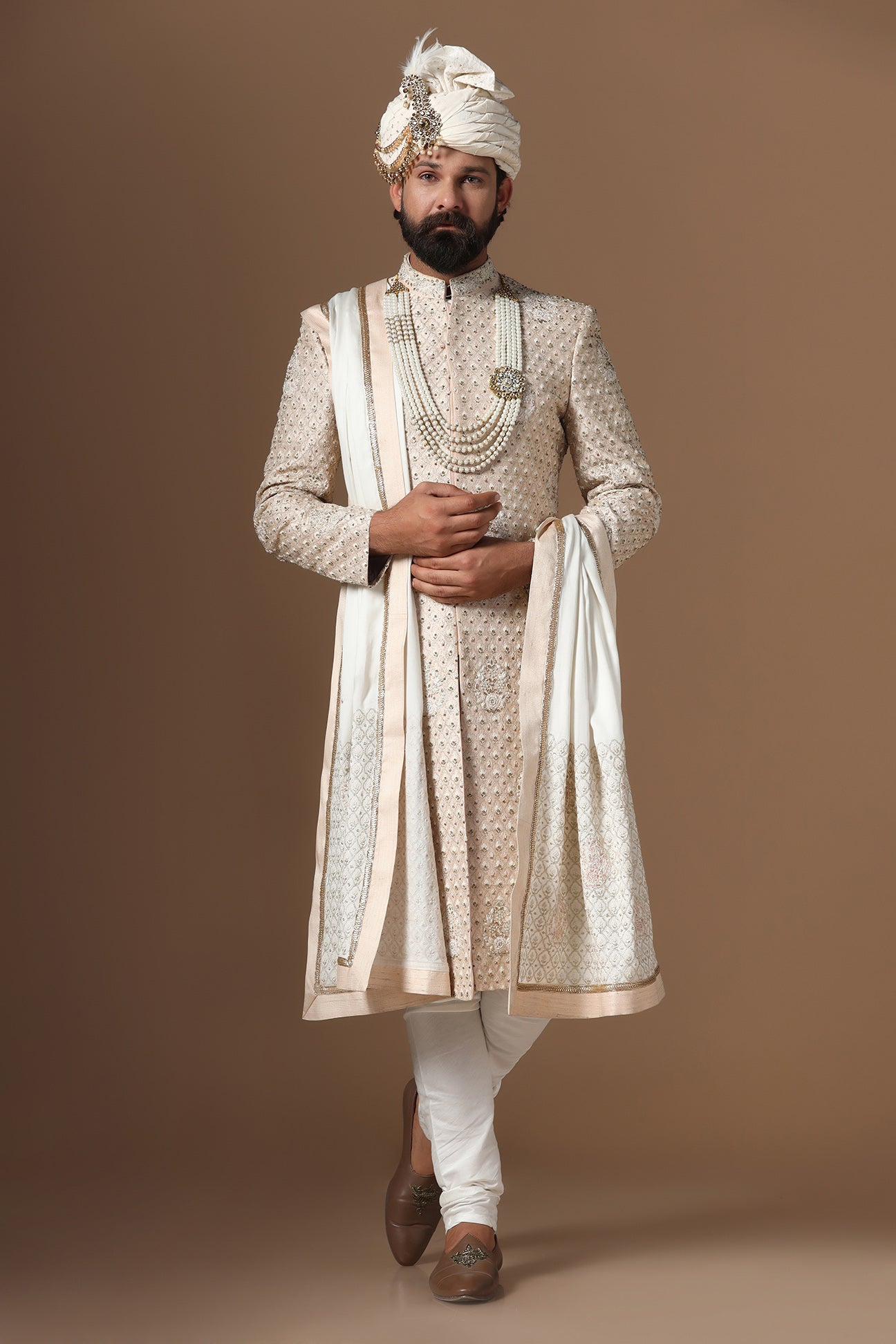 Elegance meets tradition in this light peach sherwani. Shop Now!