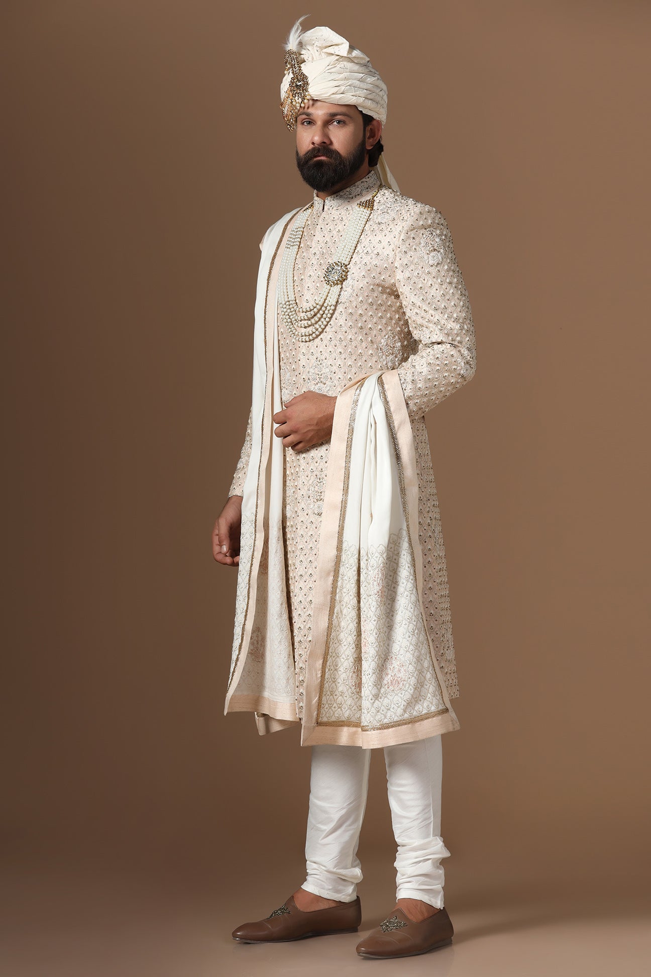 Elegance meets tradition in this light peach sherwani. Shop Now!