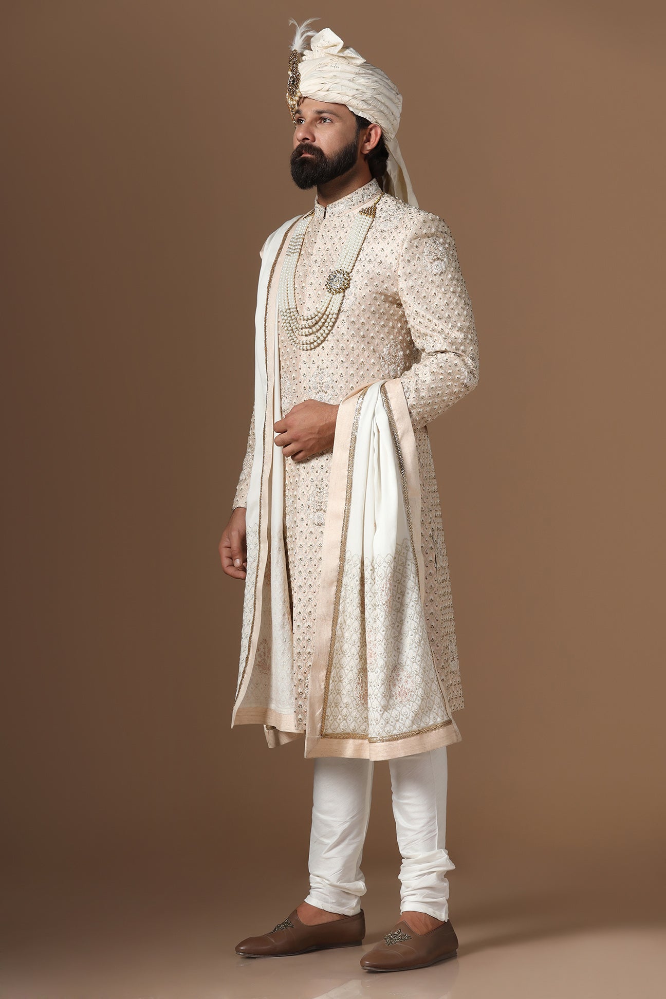 Elegance meets tradition in this light peach sherwani. Shop Now!