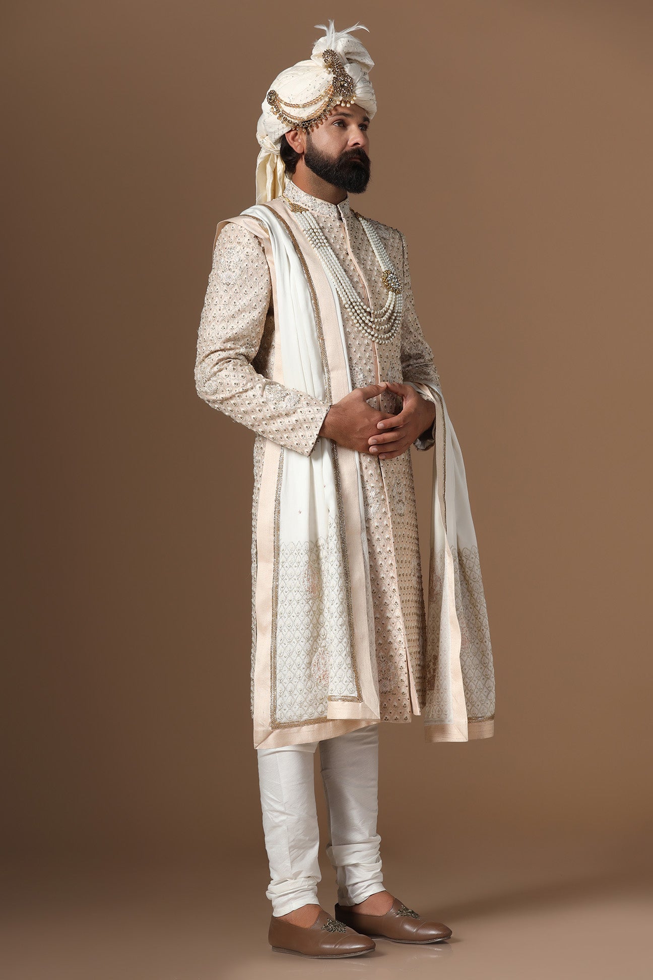 Elegance meets tradition in this light peach sherwani. Shop Now!