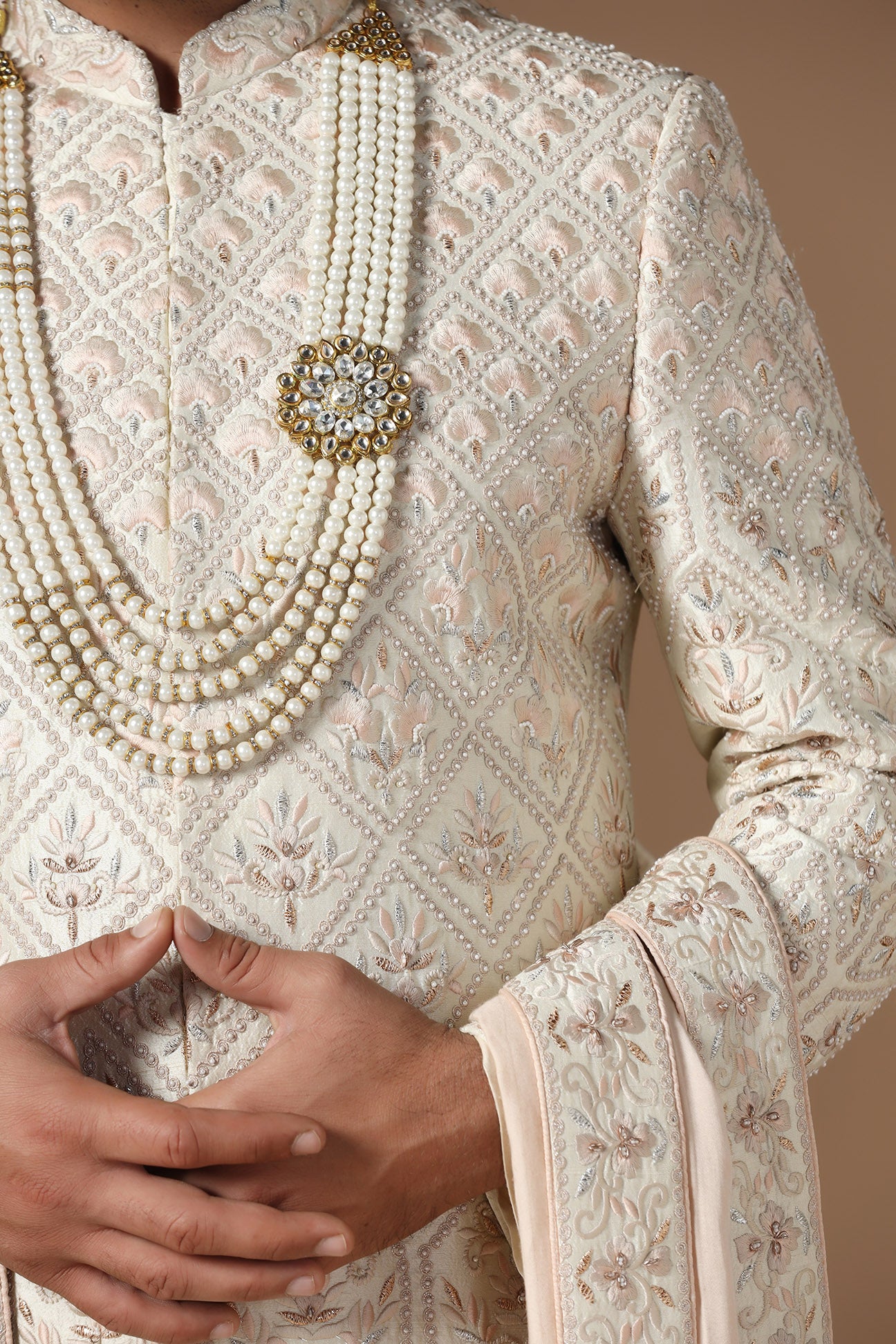 Indulge in elegance with our beige Sherwani with floral and geometric embroidery. Shop Now!