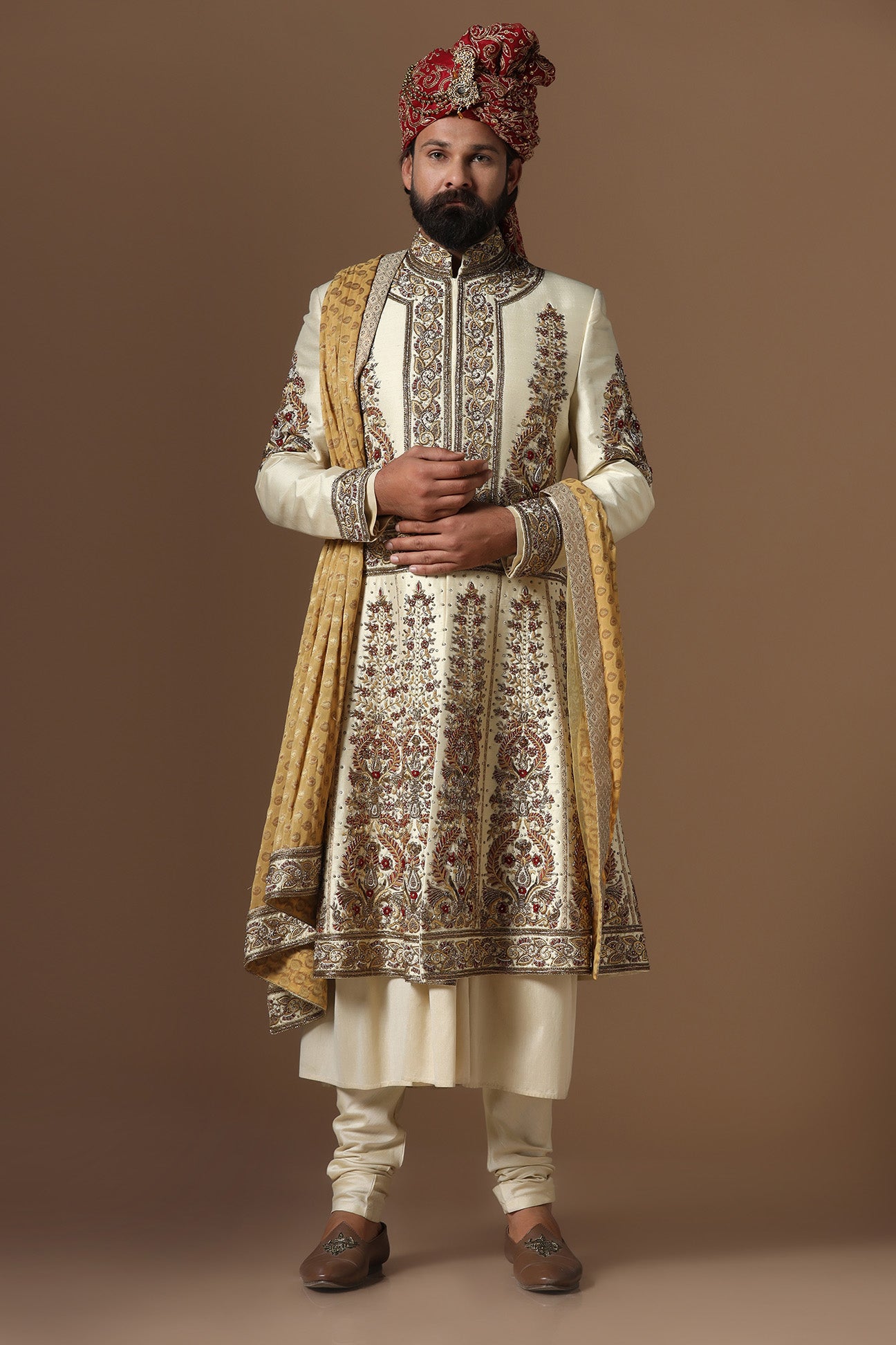 This Off-White Sherwani is highlighted by floral embroidery. Shop Now!