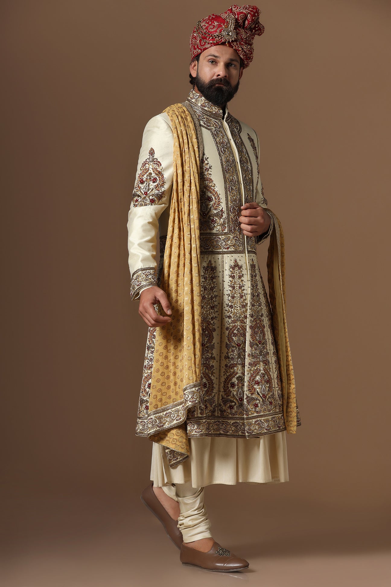 This Off-White Sherwani is highlighted by floral embroidery. Shop Now!
