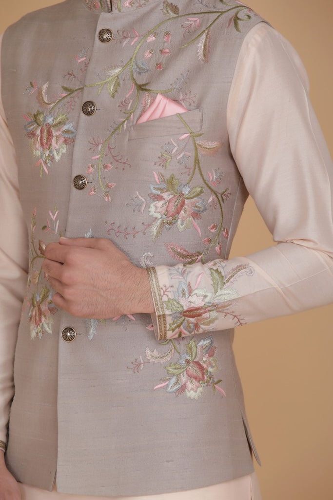 Embrace elegance with our Nehru jacket featuring floral embroidery. Paired with a short kurta and pajama for a refined ensemble.