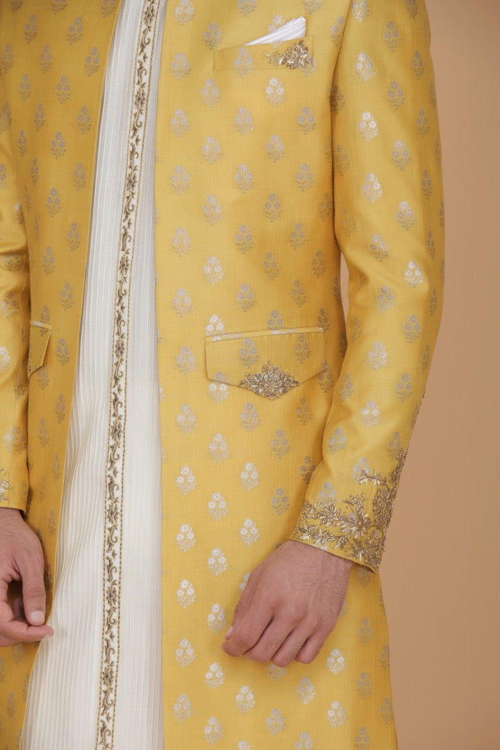This outfit consists of a front open kurta with detailed embroidery with slim trousers. Shop Now!