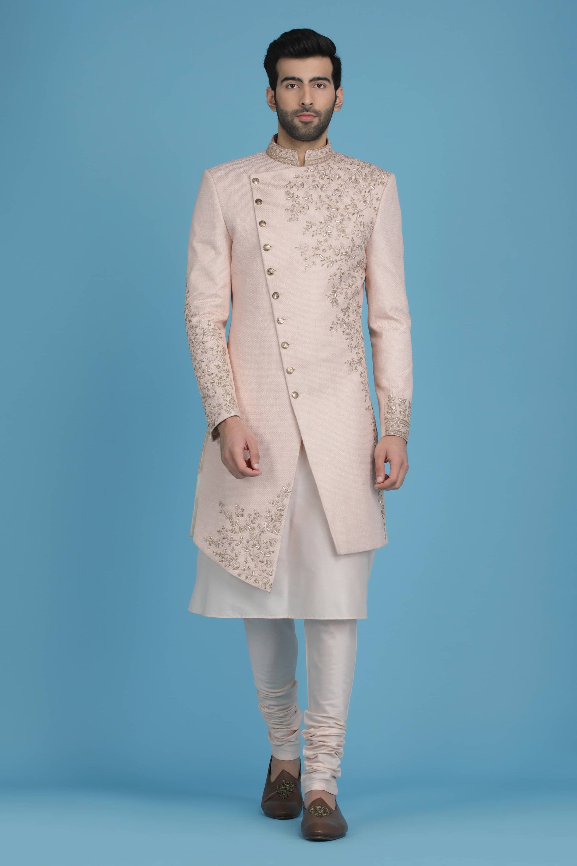This Indowestern is highlighted by panelled embroidery across the shoulder. Shop Now!