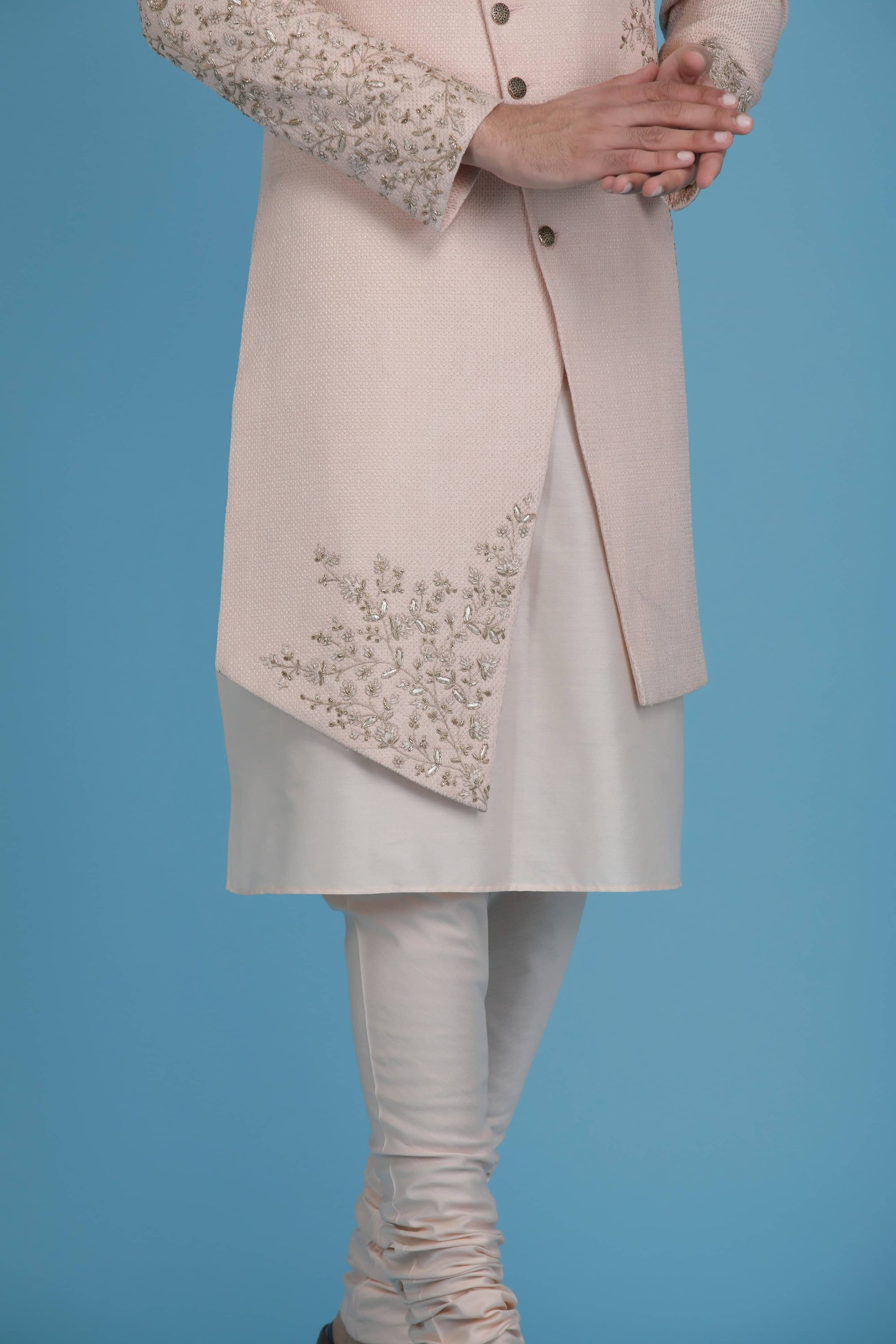 This Indowestern is highlighted by panelled embroidery across the shoulder. Shop Now!