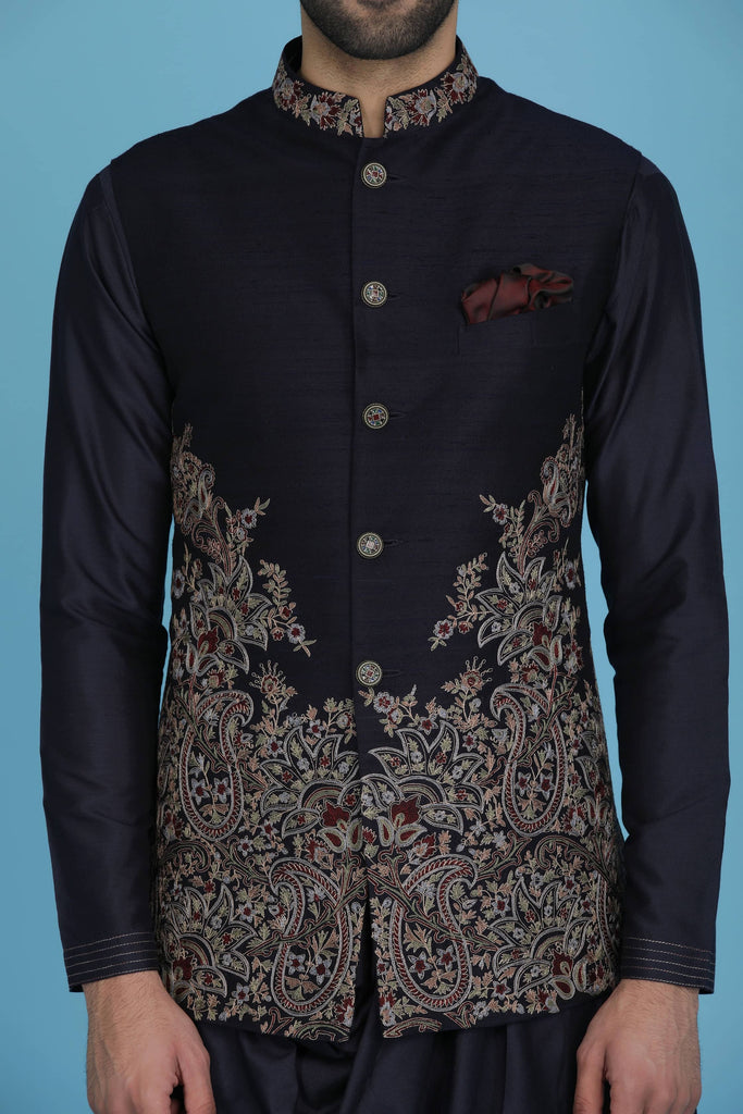 Exude regal charm in our Nehru jacket, adorned with intricate golden zari embroidery. Paired with a draped kurta and pajama set. Ships in 6-8 days.