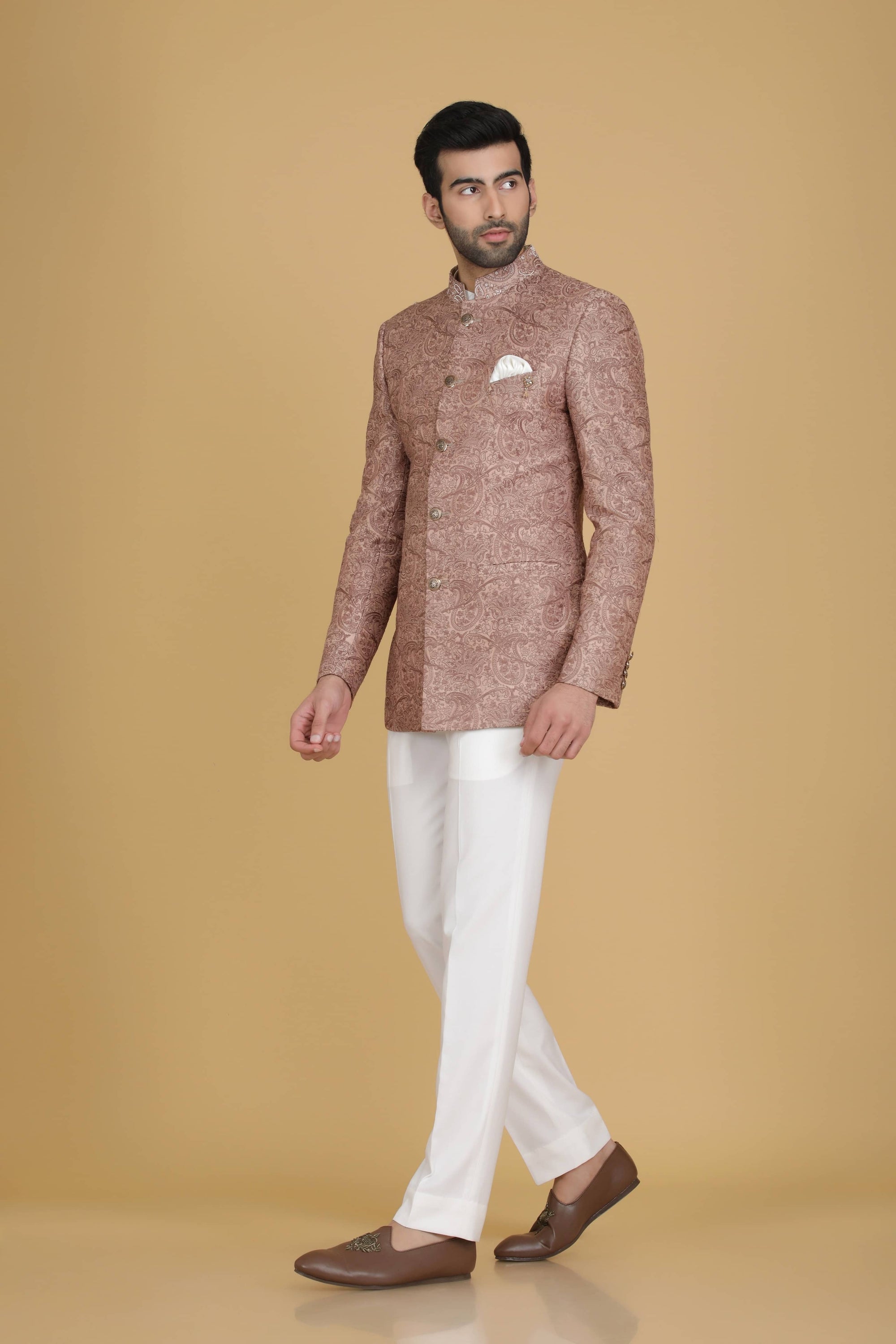 Dress in elegance with our Peach Bandhgala suit adorned with delicate embroidery. Shop Now!