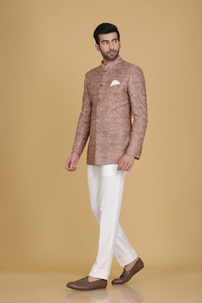 Dress in elegance with our Peach Bandhgala suit adorned with delicate embroidery. Paired with narrow trousers for a refined ensemble.