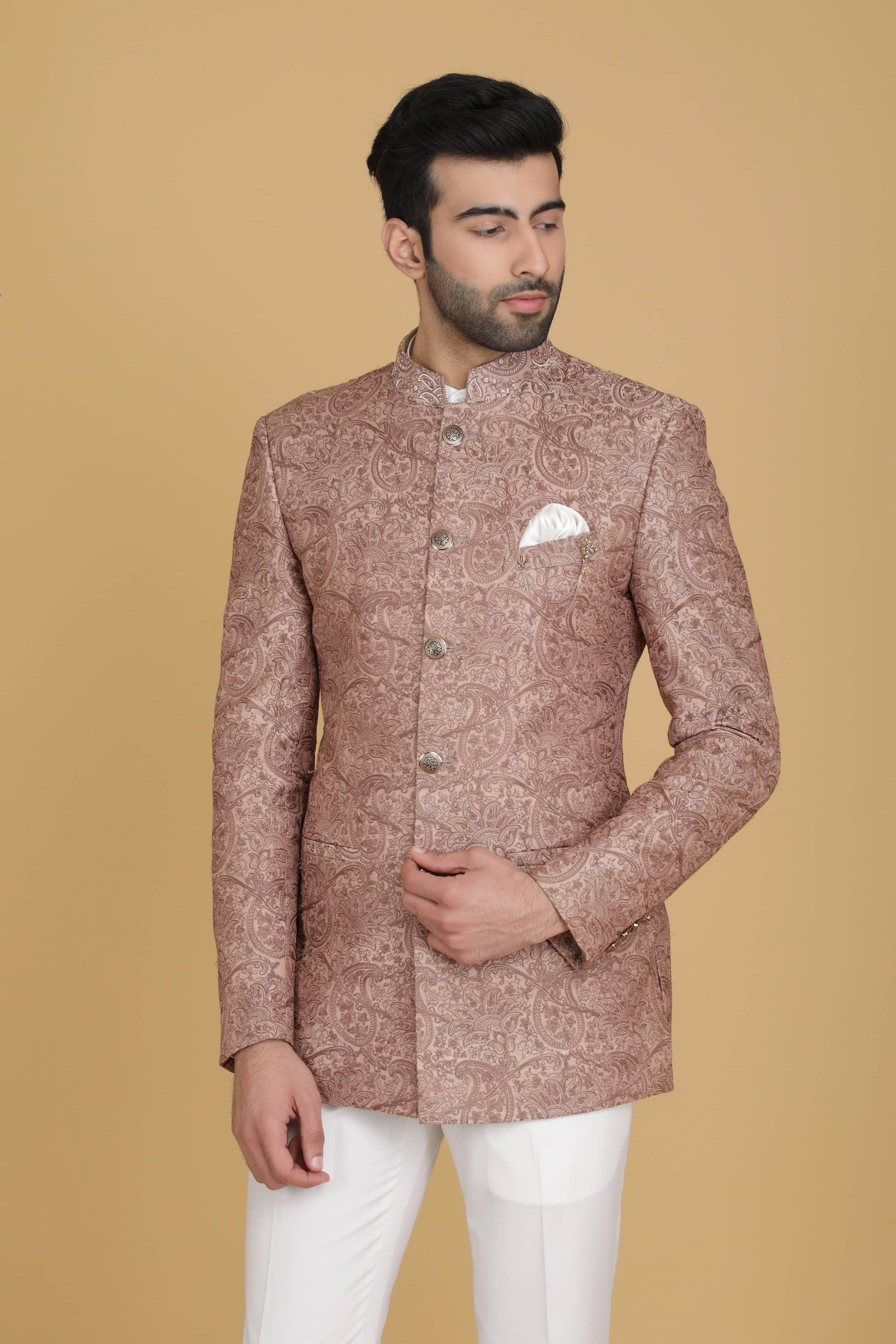 Dress in elegance with our Peach Bandhgala suit adorned with delicate embroidery. Shop Now!