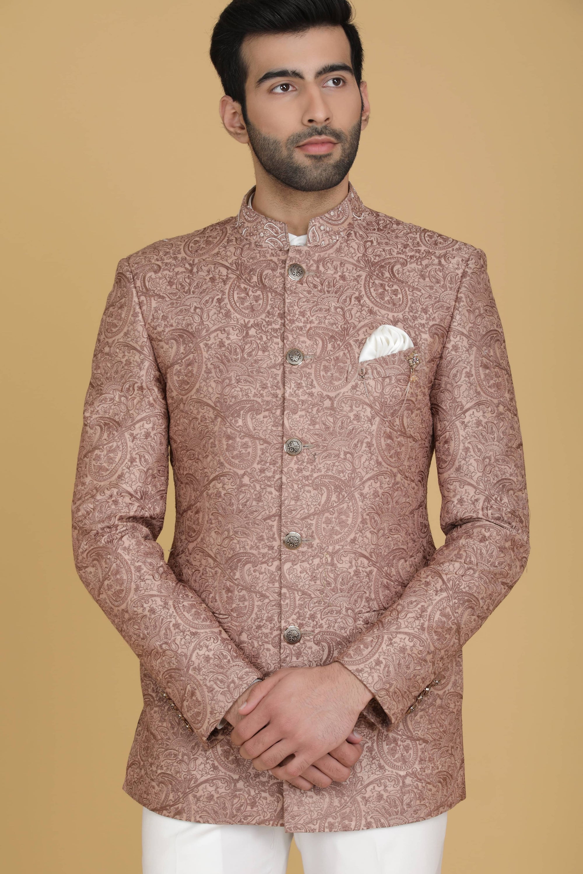 Dress in elegance with our Peach Bandhgala suit adorned with delicate embroidery. Shop Now!