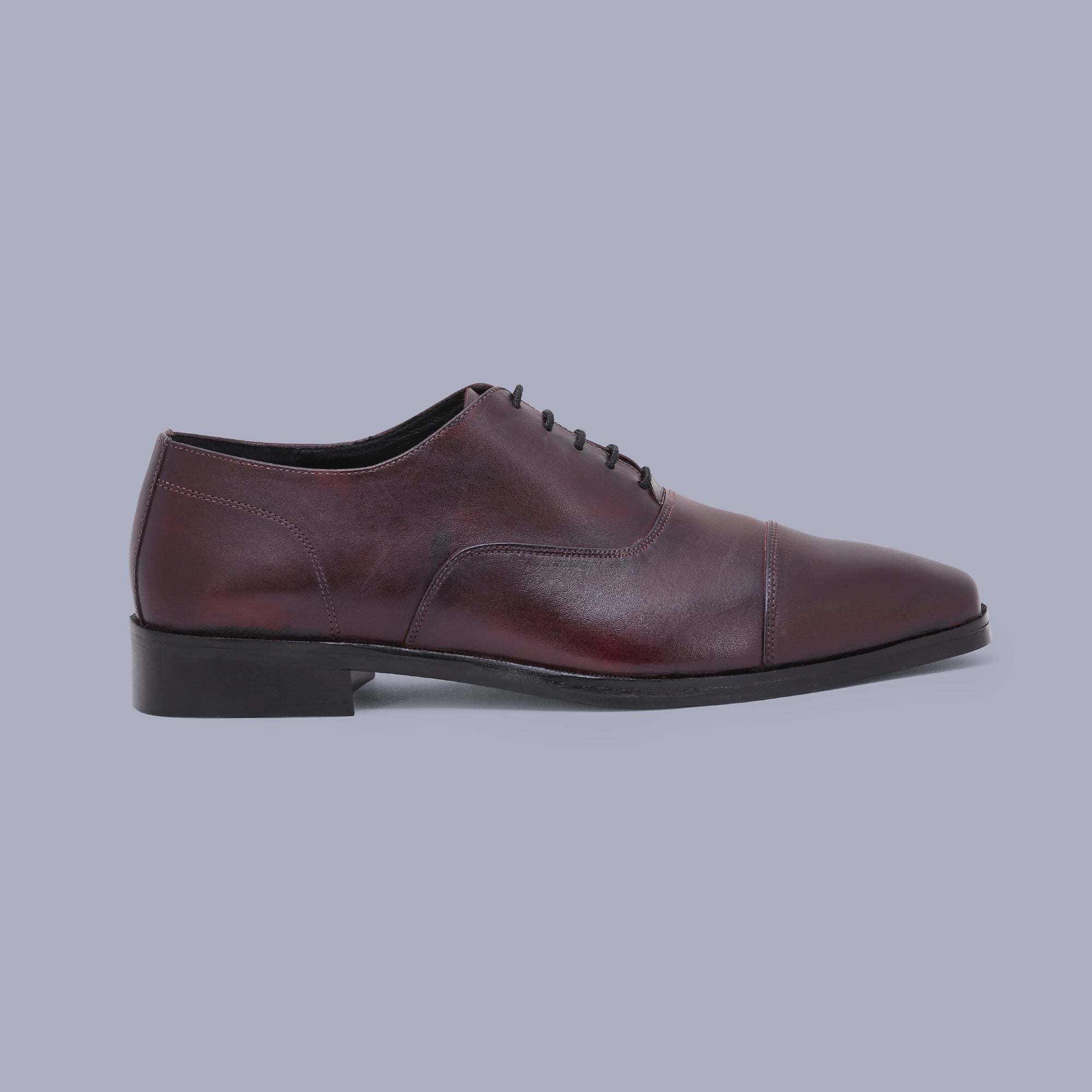 Burgundy Oxfords offer timeless charm, making them the finest shoes for men. Shop Now!