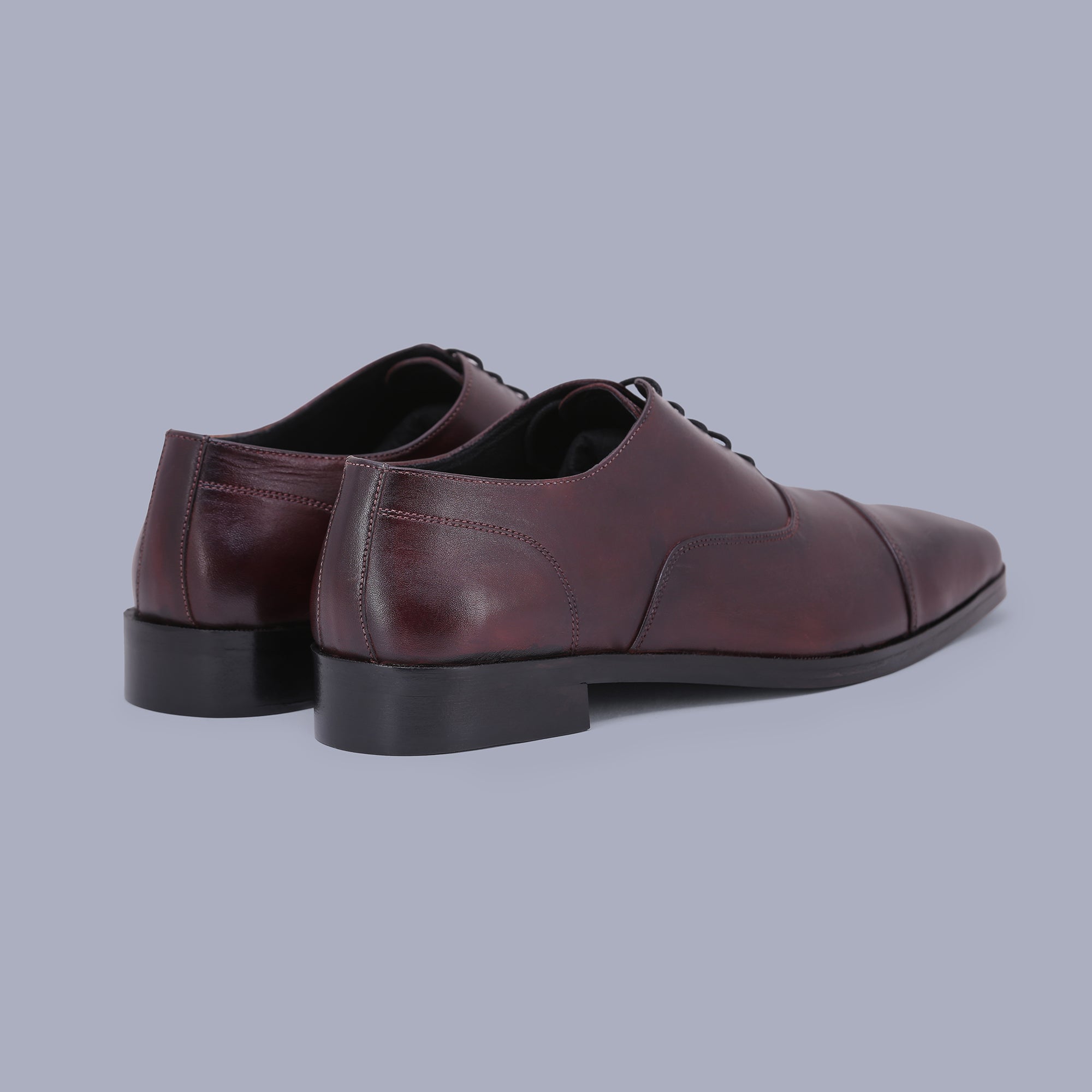 Burgundy Oxfords offer timeless charm, making them the finest shoes for men. Shop Now!
