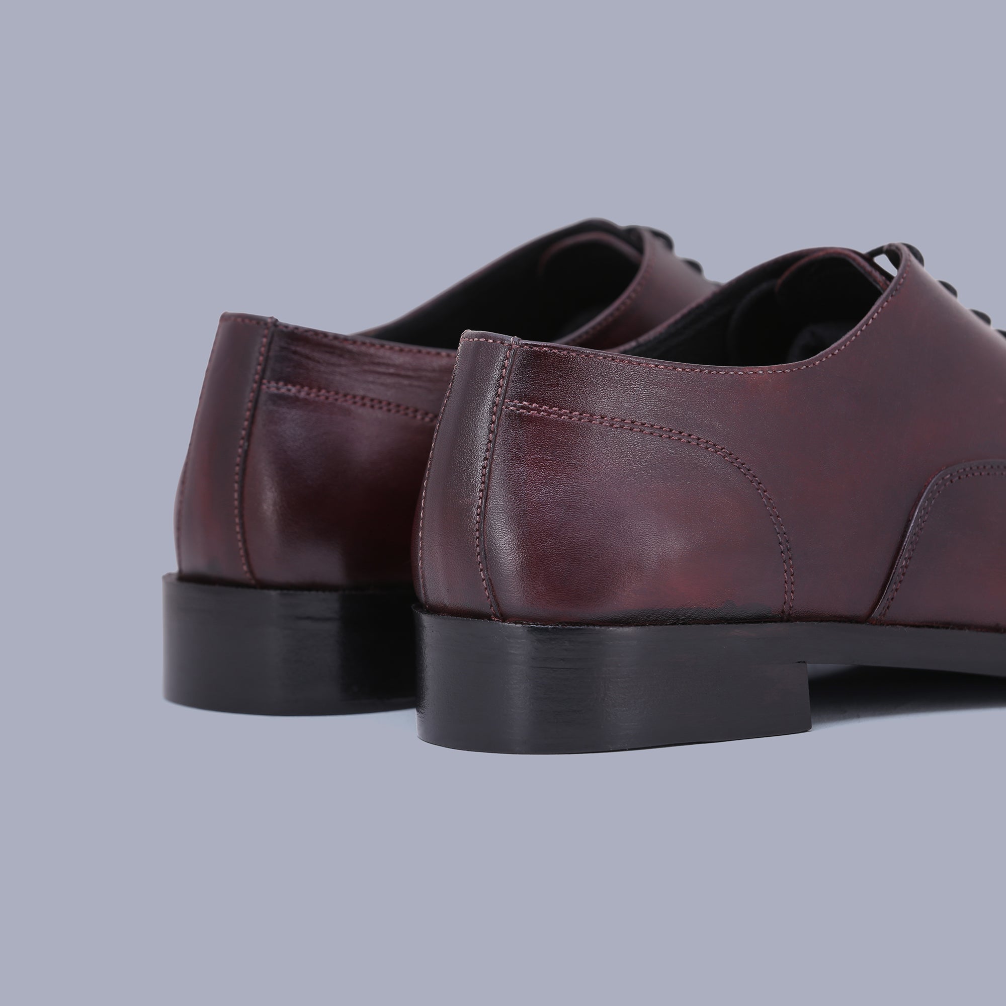 Burgundy Oxfords offer timeless charm, making them the finest shoes for men. Shop Now!