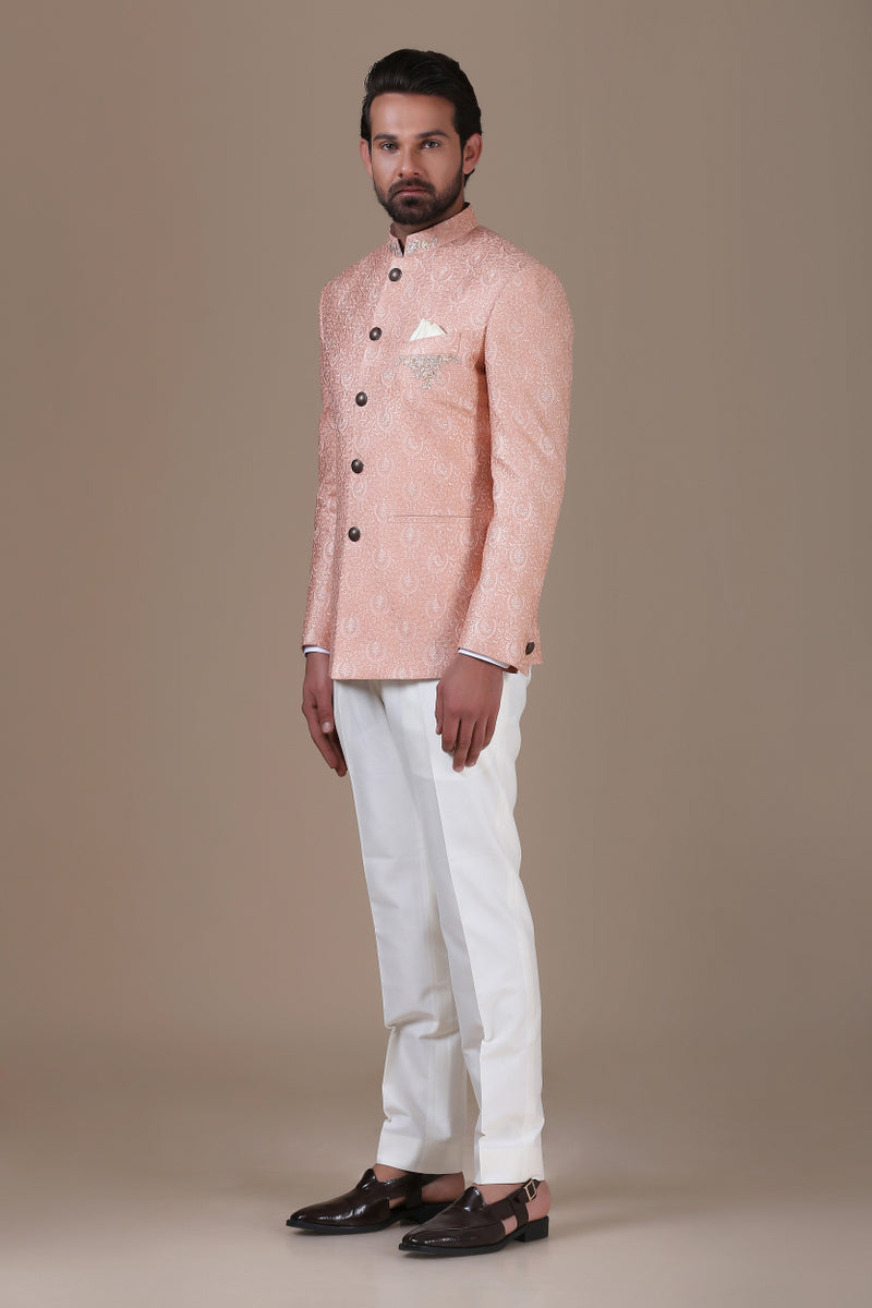 Add grace to your wardrobe with the peach embroidered bandhgala suit. Shop Now!