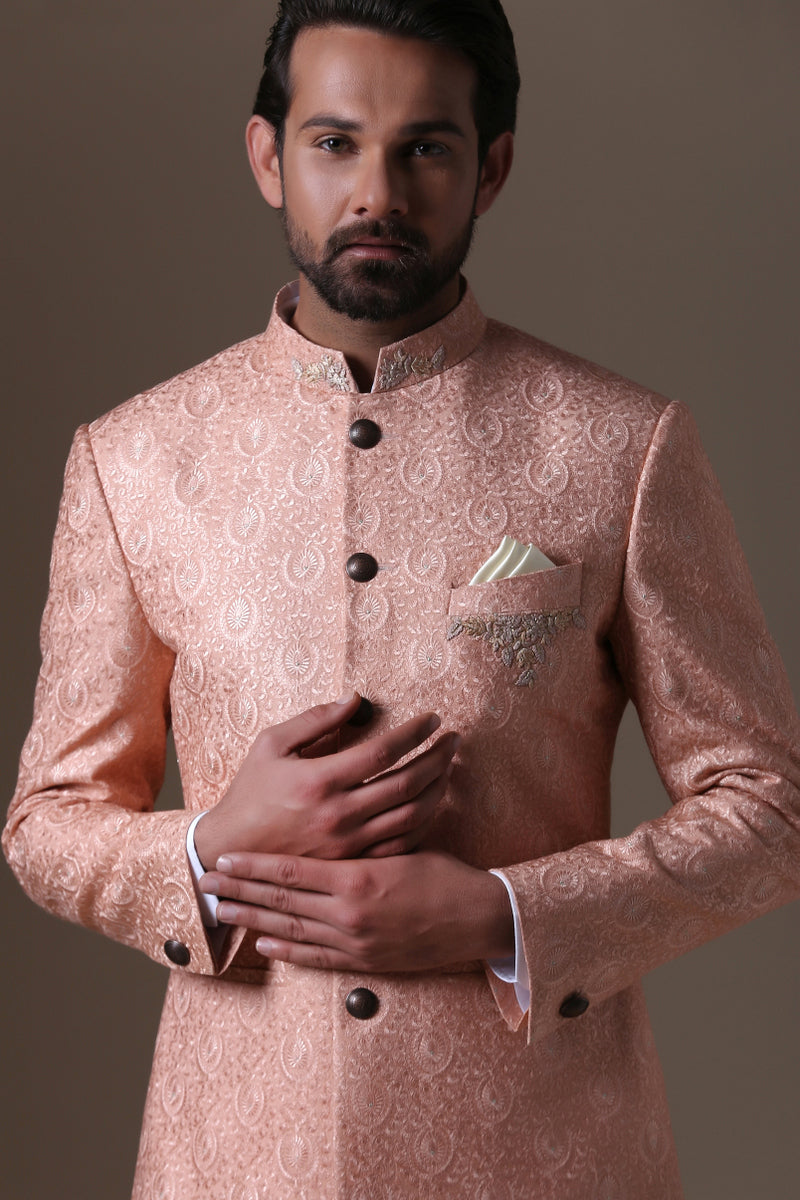 Add grace to your wardrobe with the peach embroidered bandhgala suit. Shop Now!