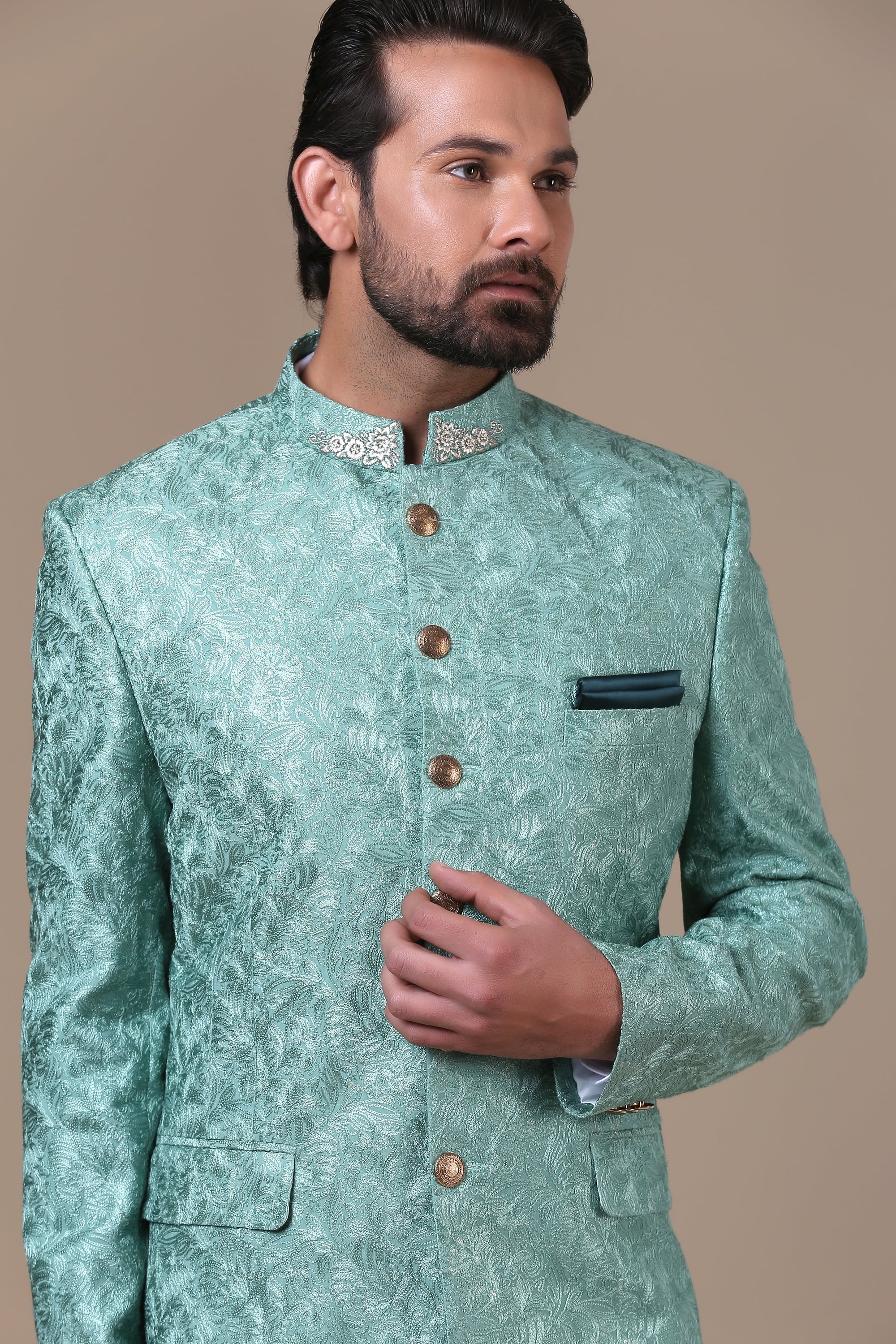 Elevate your style with the mint green embroidered Bandhgala suit. Shop now!