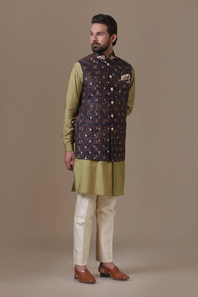 Crafted in luxurious raw silk fabric, our Nehru coat pairs with cotton trousers. Shop Now!