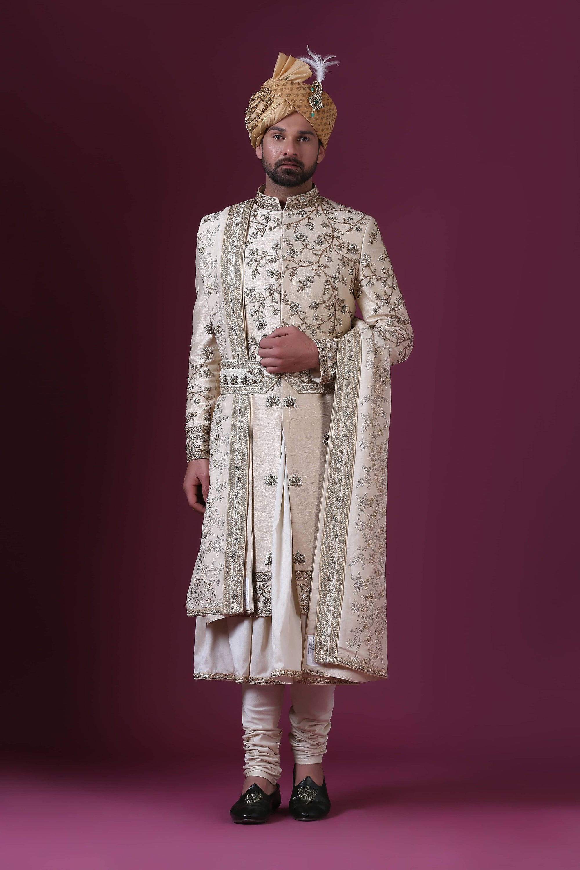 Elevate your style with this classic Sherwani adorned with bold Zari embroidery. Shop Now!