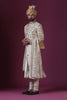 Elevate your style with this classic Sherwani adorned with bold Zari embroidery in a timeless floral pattern. The blend of gold and silver adds exquisite elegance.