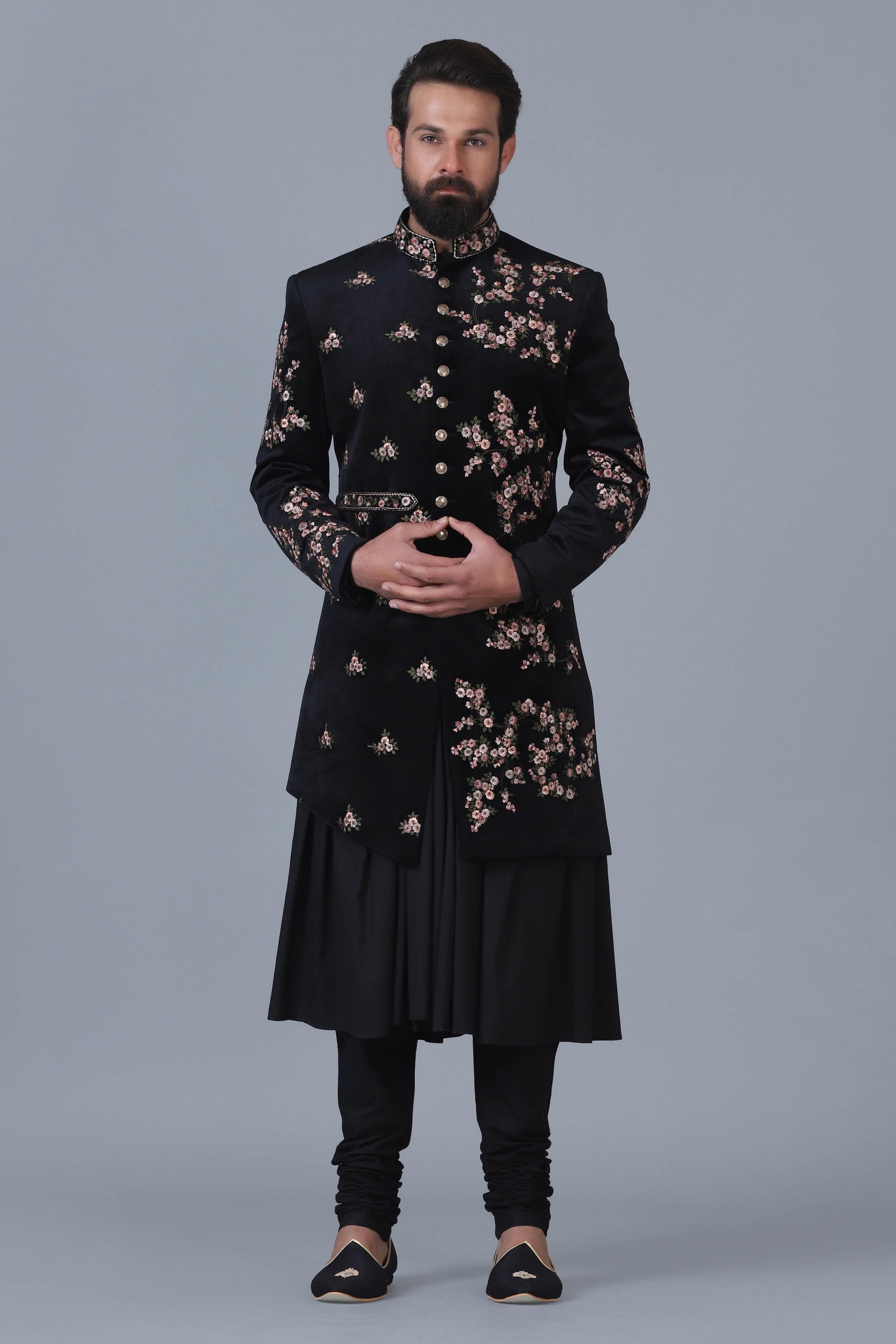 Exude sophistication in our black velvet Indowestern with intricate floral embroidery. Shop Now!