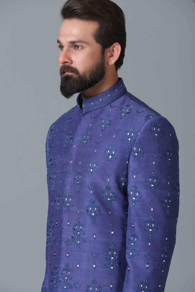 Elevate your style with our indigo blue Indowestern featuring embroidered motifs. Complete the look with a matching blue kurta pajama set.
