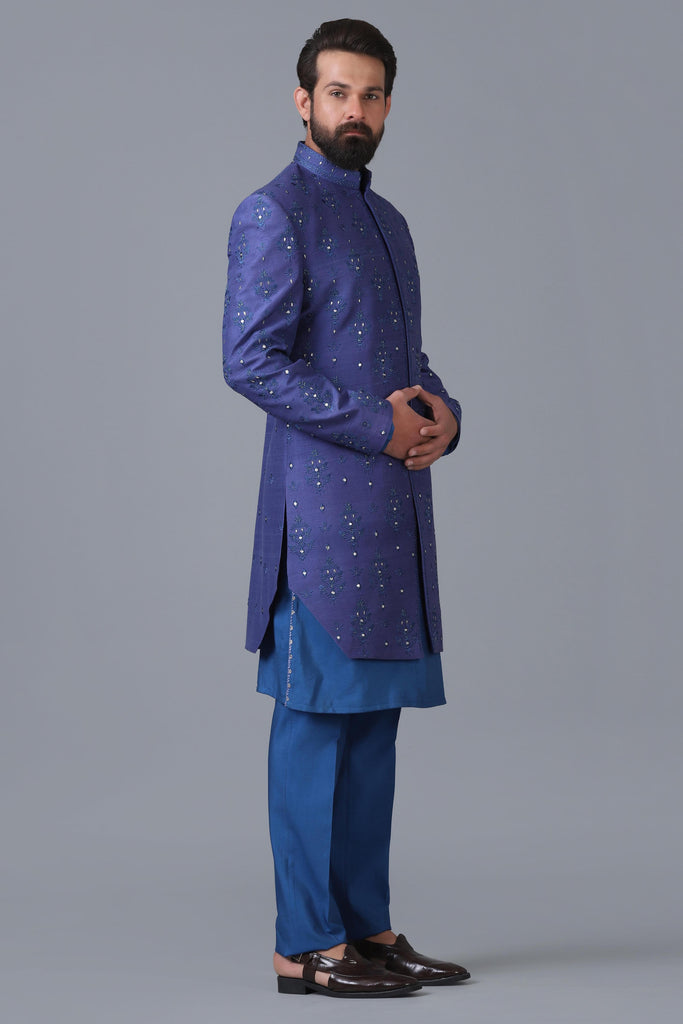 Elevate your style with our indigo blue Indowestern featuring embroidered motifs. Complete the look with a matching blue kurta pajama set.