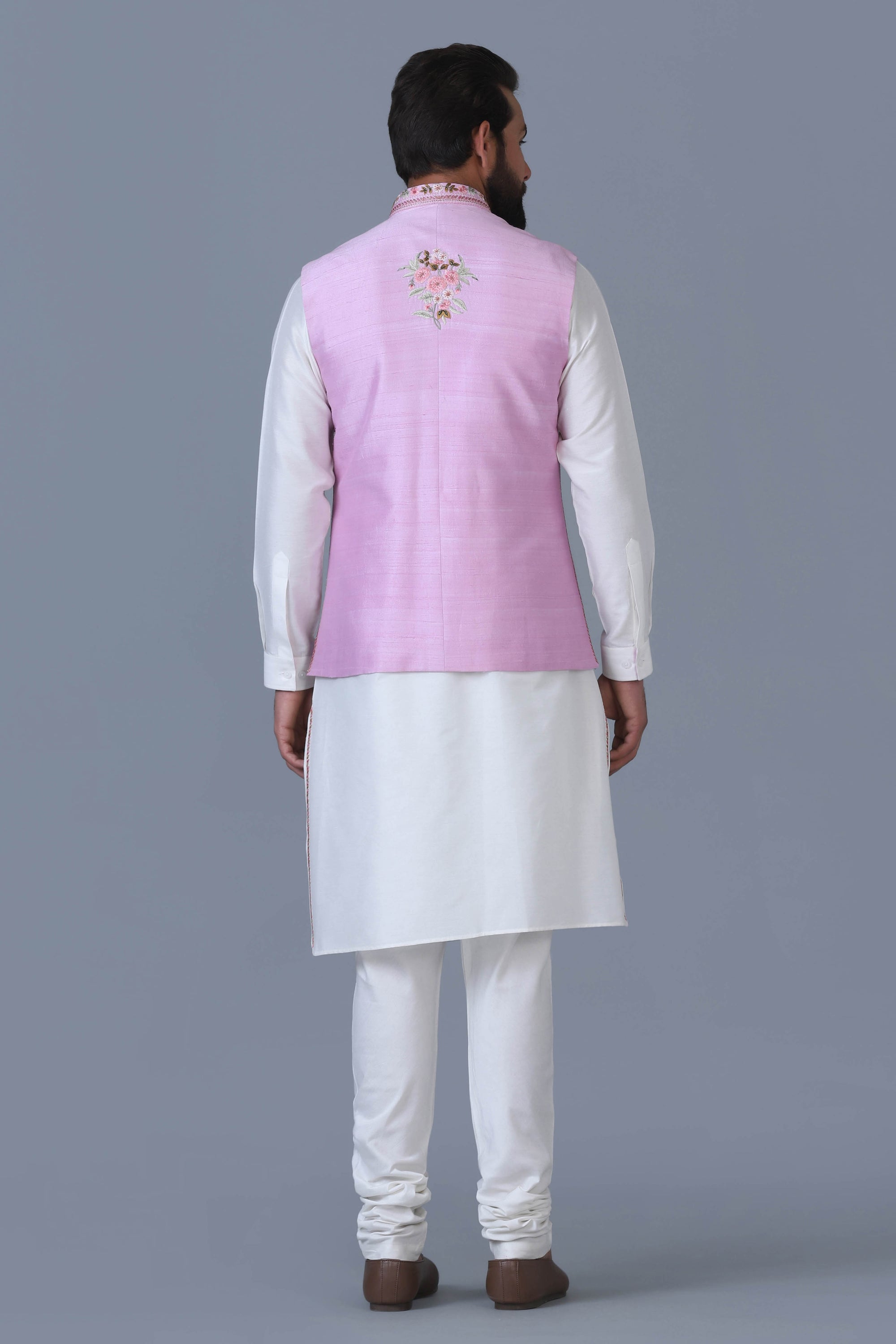 Elevate your style with our light pink Nehru Jacket, adorned with intricate floral motifs. Shop Now!
