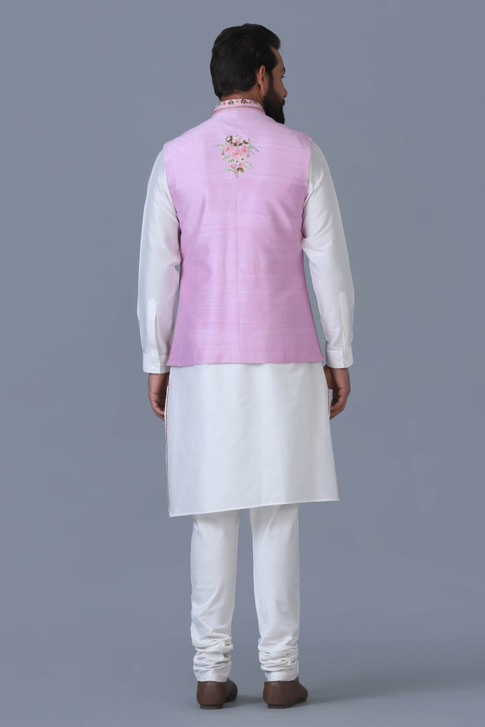 Elevate your style with our light pink Nehru Jacket, adorned with intricate floral motifs, perfectly paired with an off-white kurta pajama ensemble.