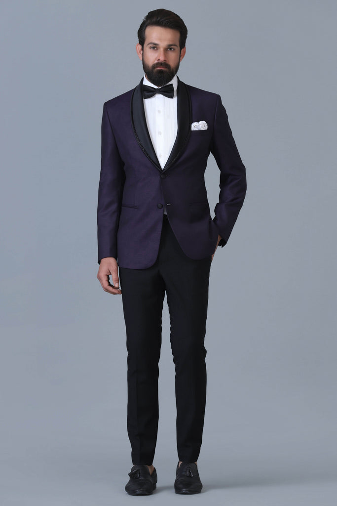 Make a statement in our Designer Purple Jacquard Tuxedo. Embellished shawl lapel, crafted from luxurious wool-rich fabric. Paired with jet-black trousers for timeless elegance.