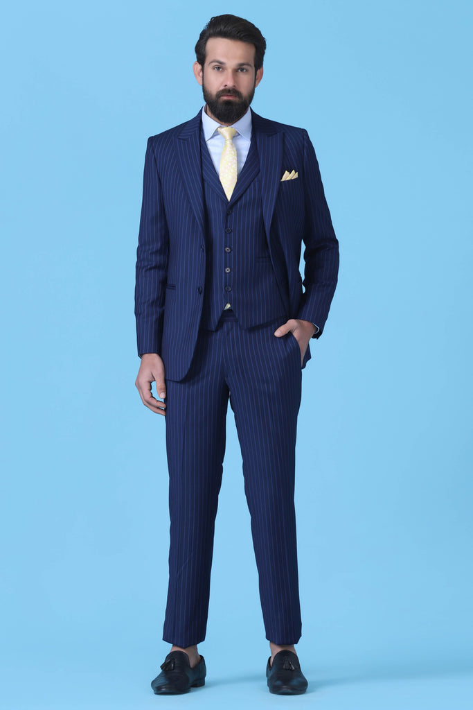 Elevate your style with our bold Pinstripe Suit. Crafted from Navy Blue Terry-Rayon Fabric, featuring a peak lapel and a 5-button Waistcoat.