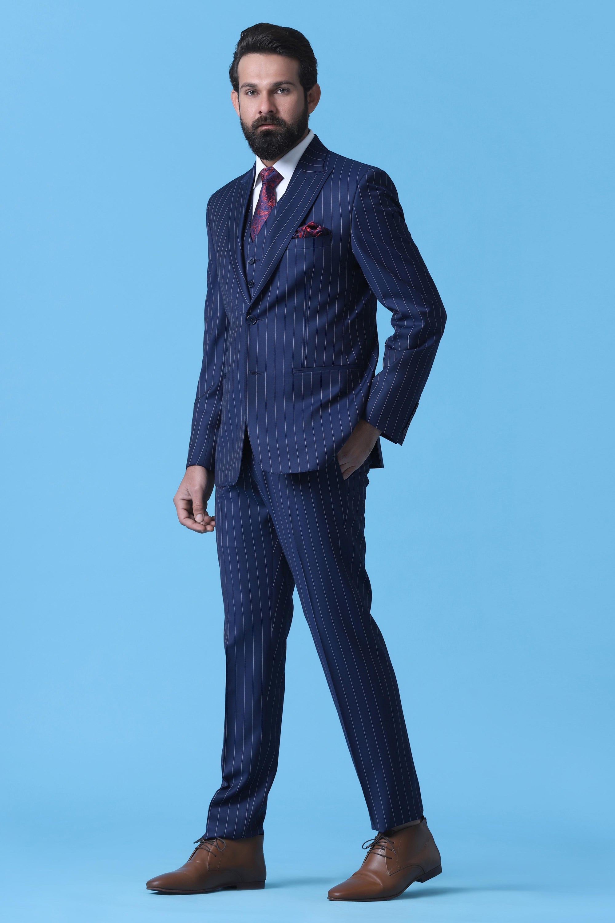 Make a statement with our Bold 3-Piece Suit in Navy Chalkstripe Wool Fabric. Shop Now!
