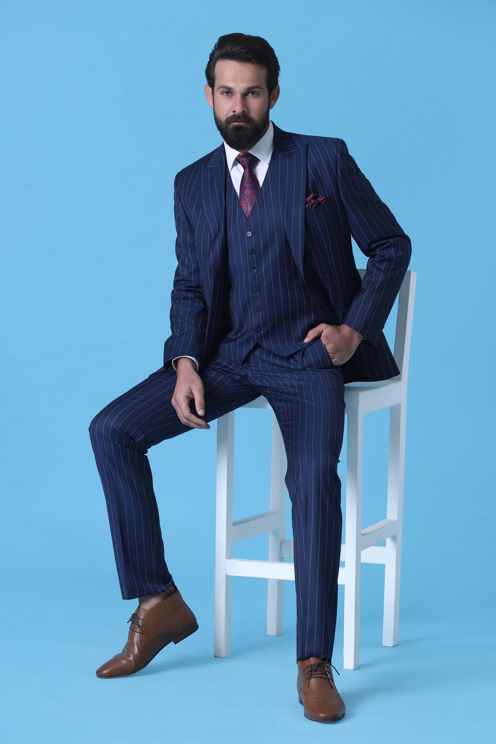 Make a statement with our Bold 3-Piece Suit in Navy Chalkstripe Wool Fabric. Shop Now!