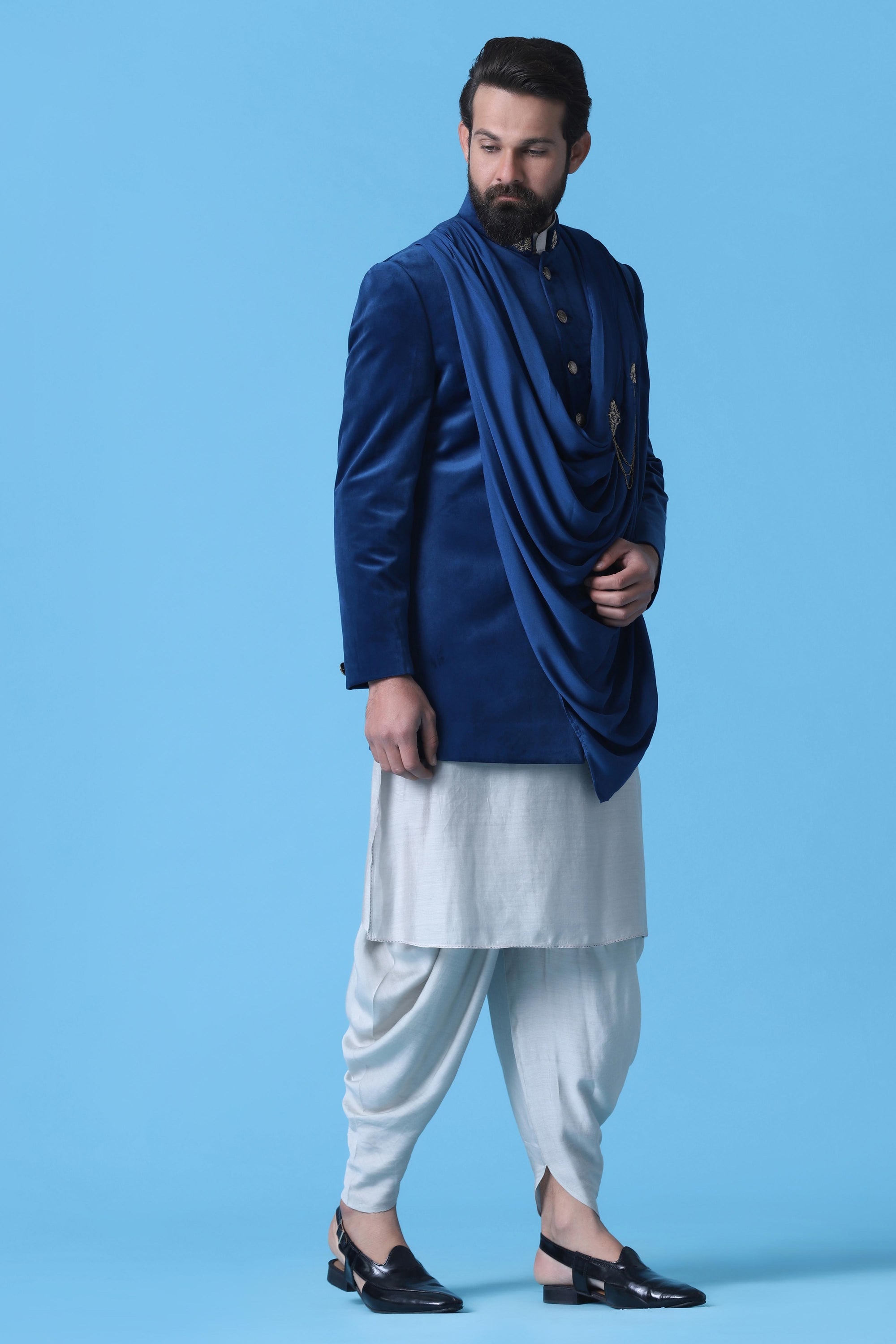 Make a statement in this Blue Velvet Indowestern featuring a stylish drape. Shop Now!