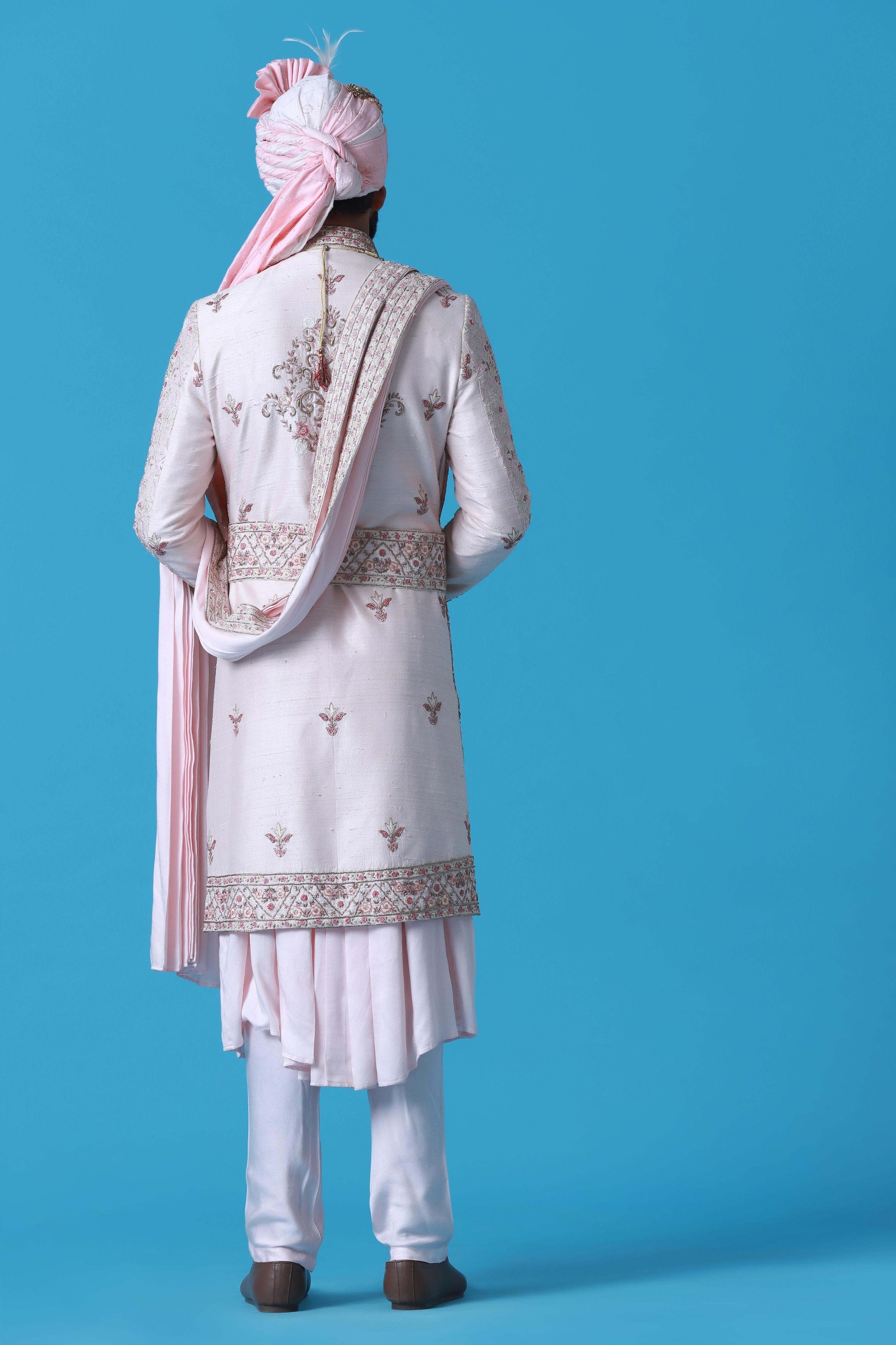 Elevate your style with this regal Sherwani crafted from fine raw silk fabric. Shop Now!