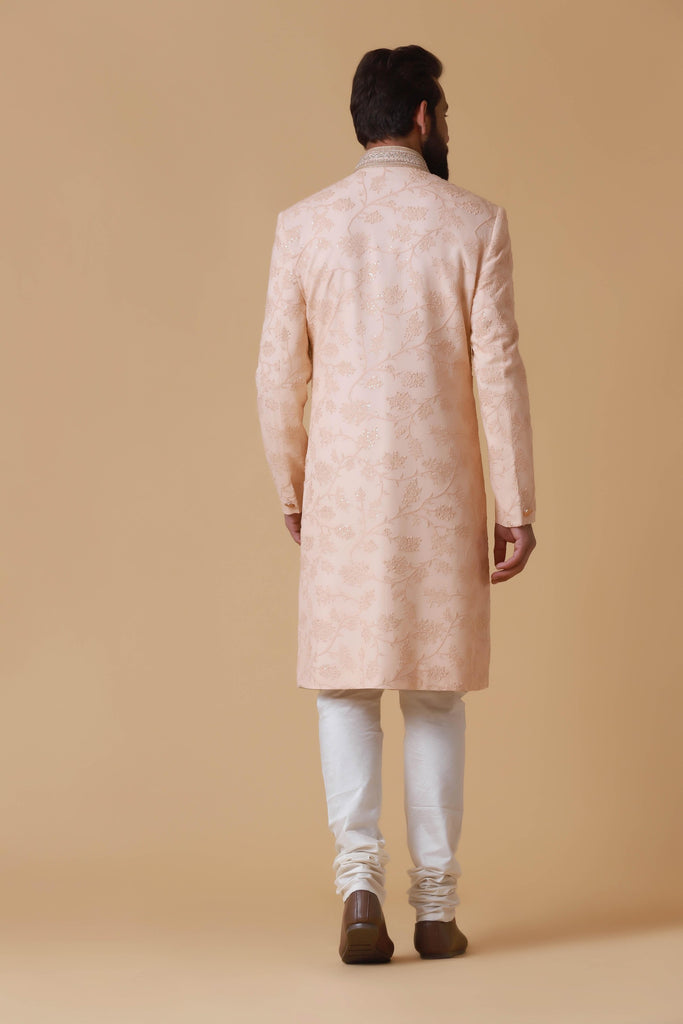 Elevate your summer wedding attire with this pink embroidered Indowestern, crafted from lightweight cotton chiffon and adorned with tonal floral embroidery.