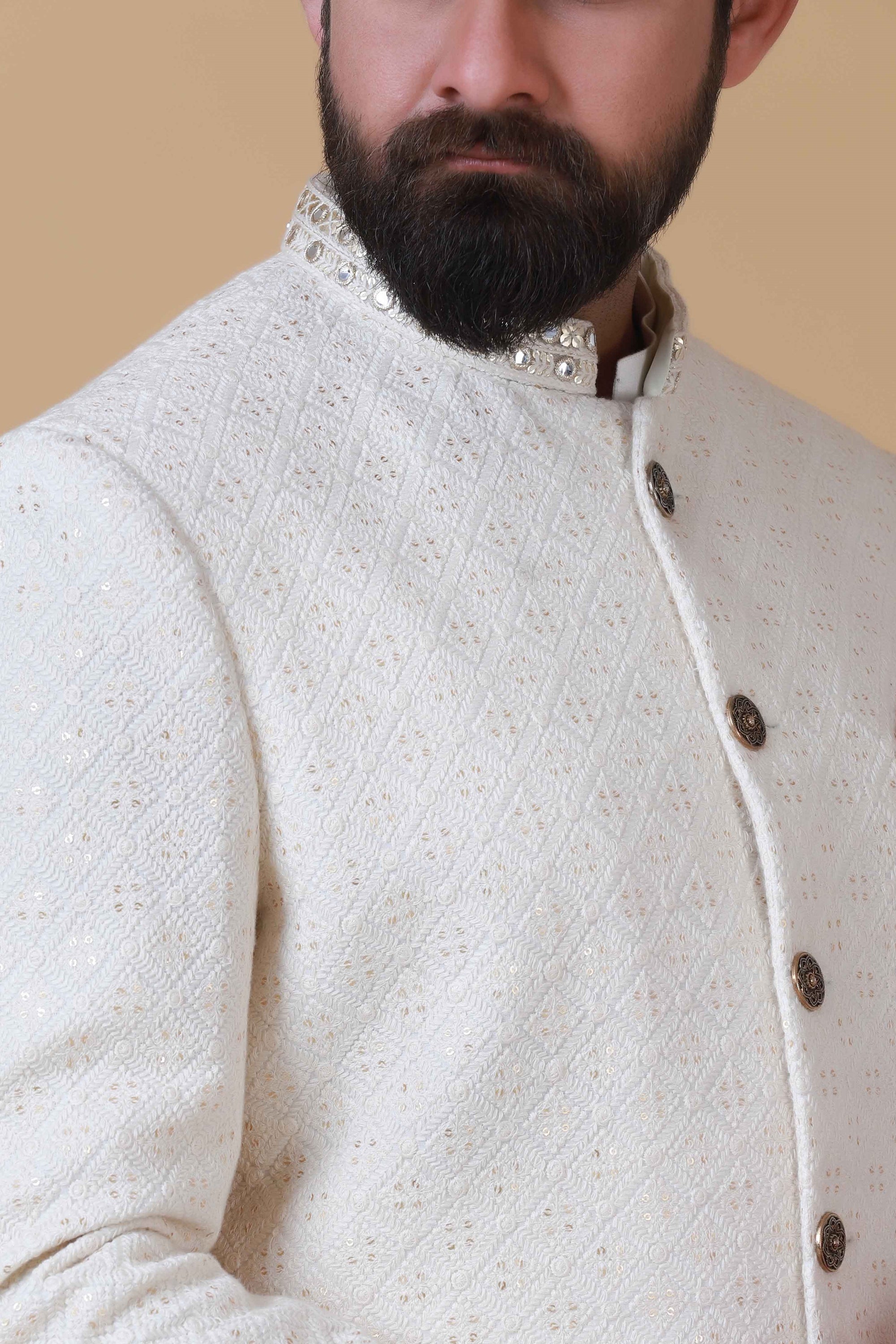 Designer Sherwani with soft colours and intricate embroidery. Shop Now!