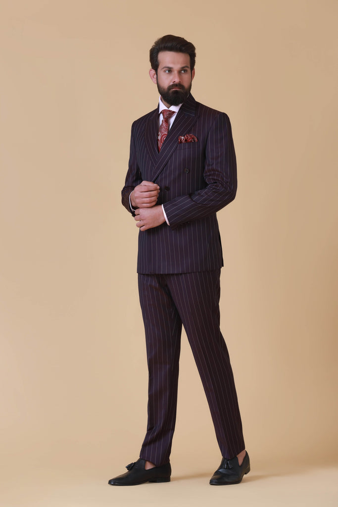 Elevate your style with our versatile Wine Pinstripe Suit. Peak lapel, 6 buttons, double vent at the back. Flat front trousers for a polished look.