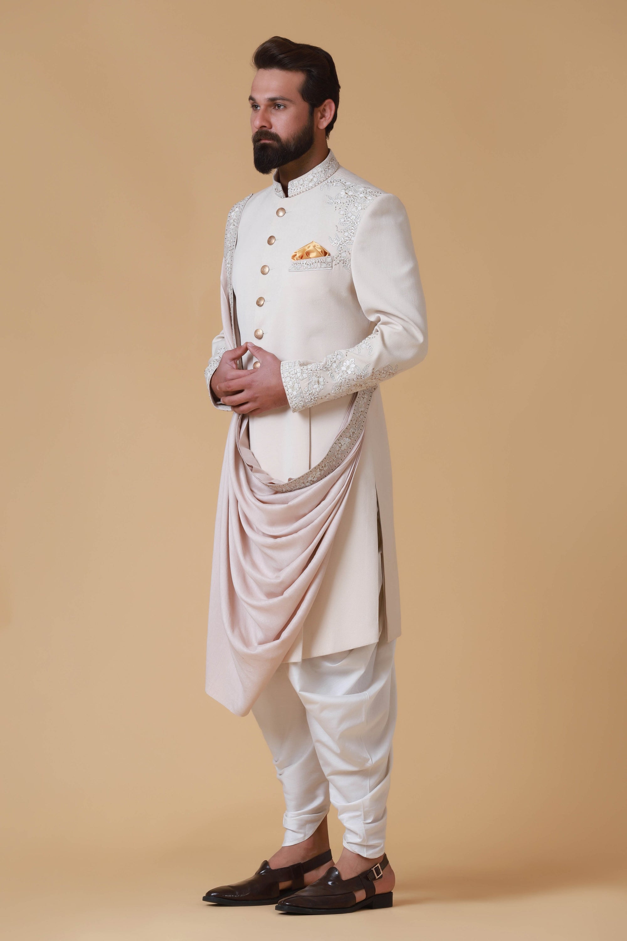 Designer Sherwani with soft colours and intricate embroidery. Shop Now!