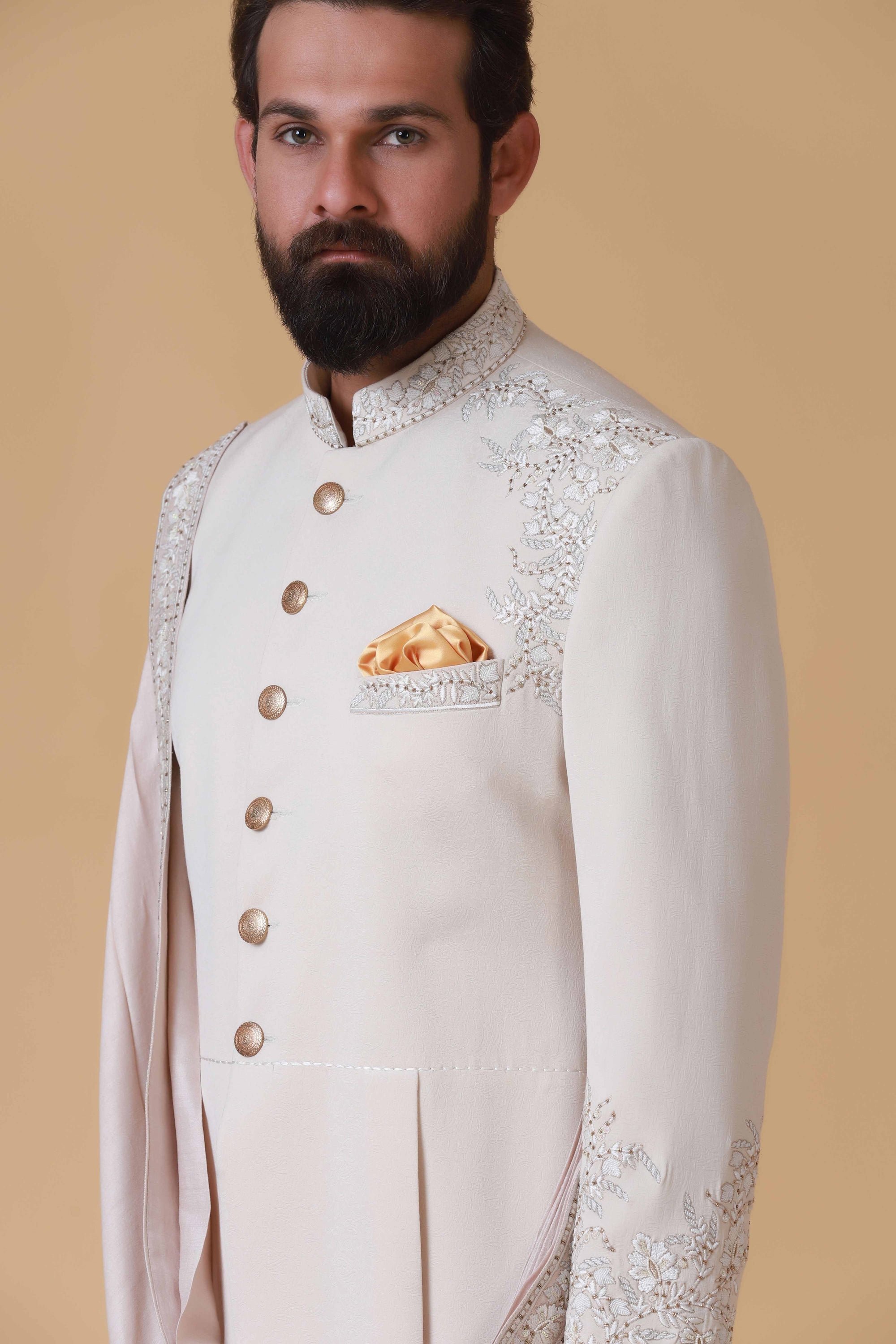 Designer Sherwani with soft colours and intricate embroidery. Shop Now!