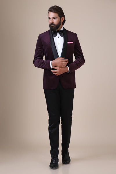 Elevate your style with our wine velvet Tuxedo. Shawl collar, single button closure. Paired with Jet-Black trousers for a refined ensemble.