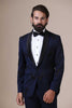 Elevate your style with our shawl collar Tuxedo. Single button closure, navy blue coat adorned with subtle black embroidery. Paired with black trousers.