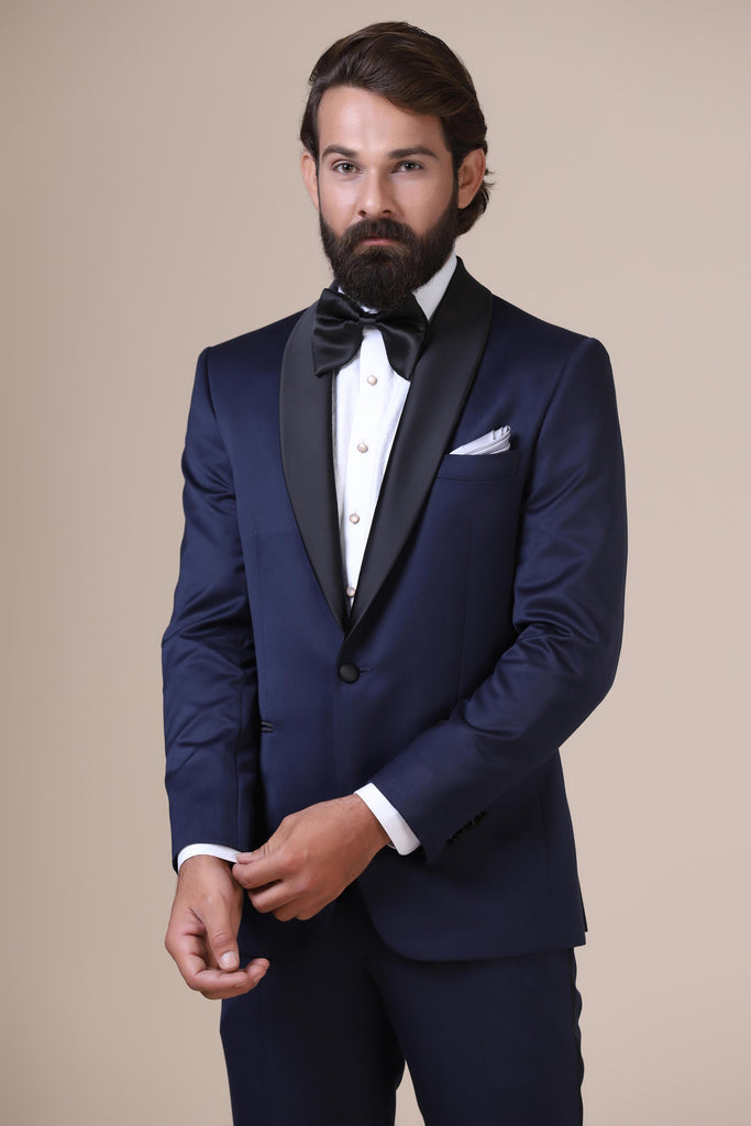 Dress with timeless elegance in our classic shawl lapel tuxedo. Crafted from fine satin-wool fabric, featuring a single button closure.