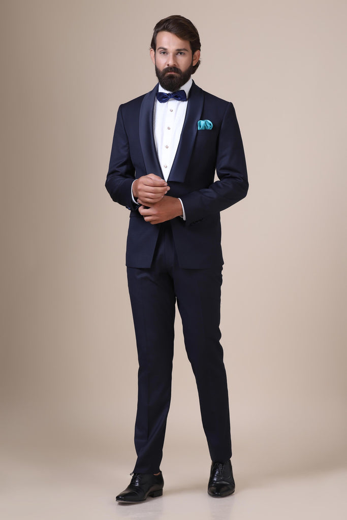 Experience sophistication in our Contemporary Tuxedo. With sharp cuts and a modern shawl lapel, crafted from Italian wool fabric with a subtle texture.