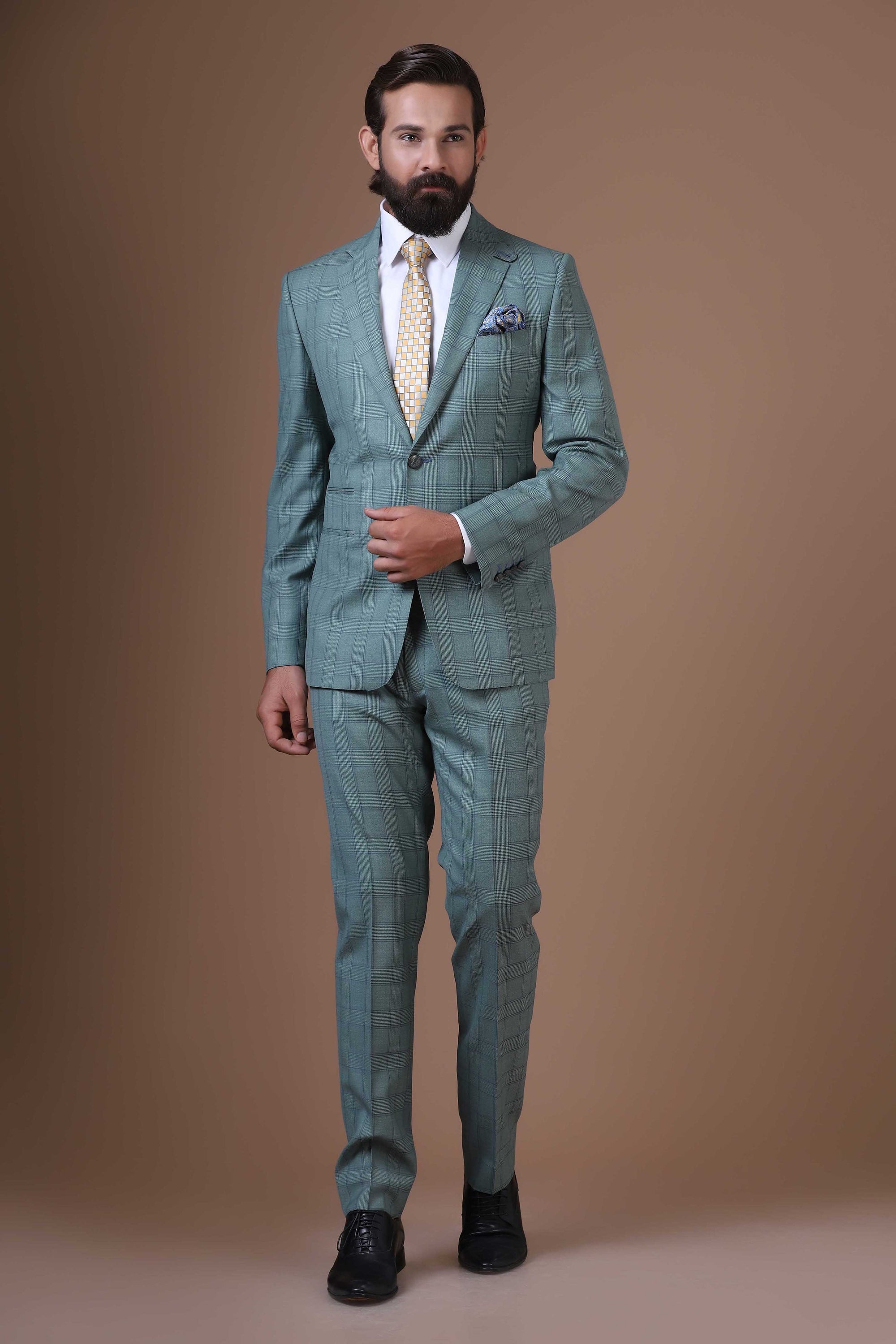 Elevate your ensemble with our two-button, notch lapel suit crafted from 100% wool fabric. Shop Now!