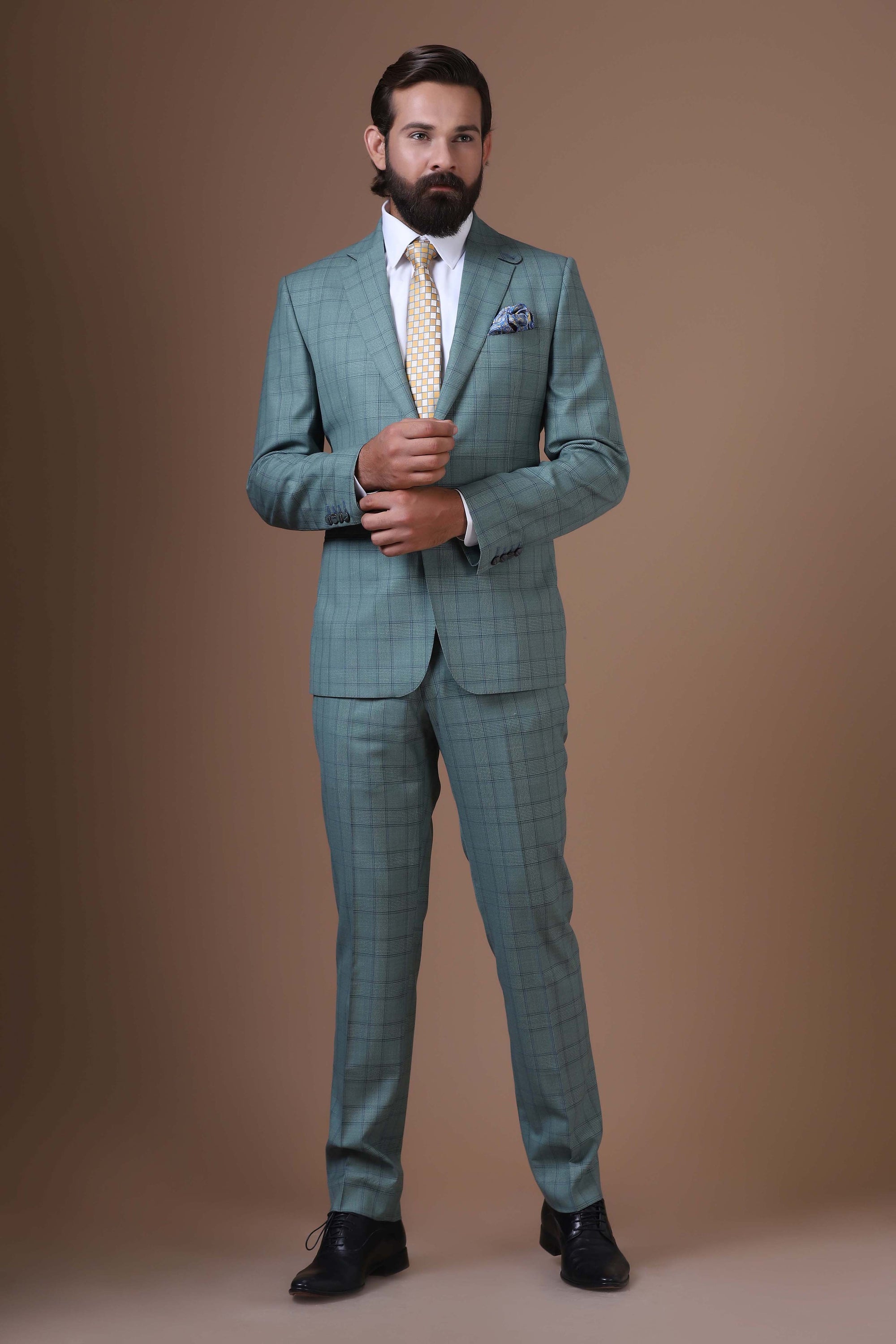 Elevate your ensemble with our two-button, notch lapel suit crafted from 100% wool fabric. Shop Now!
