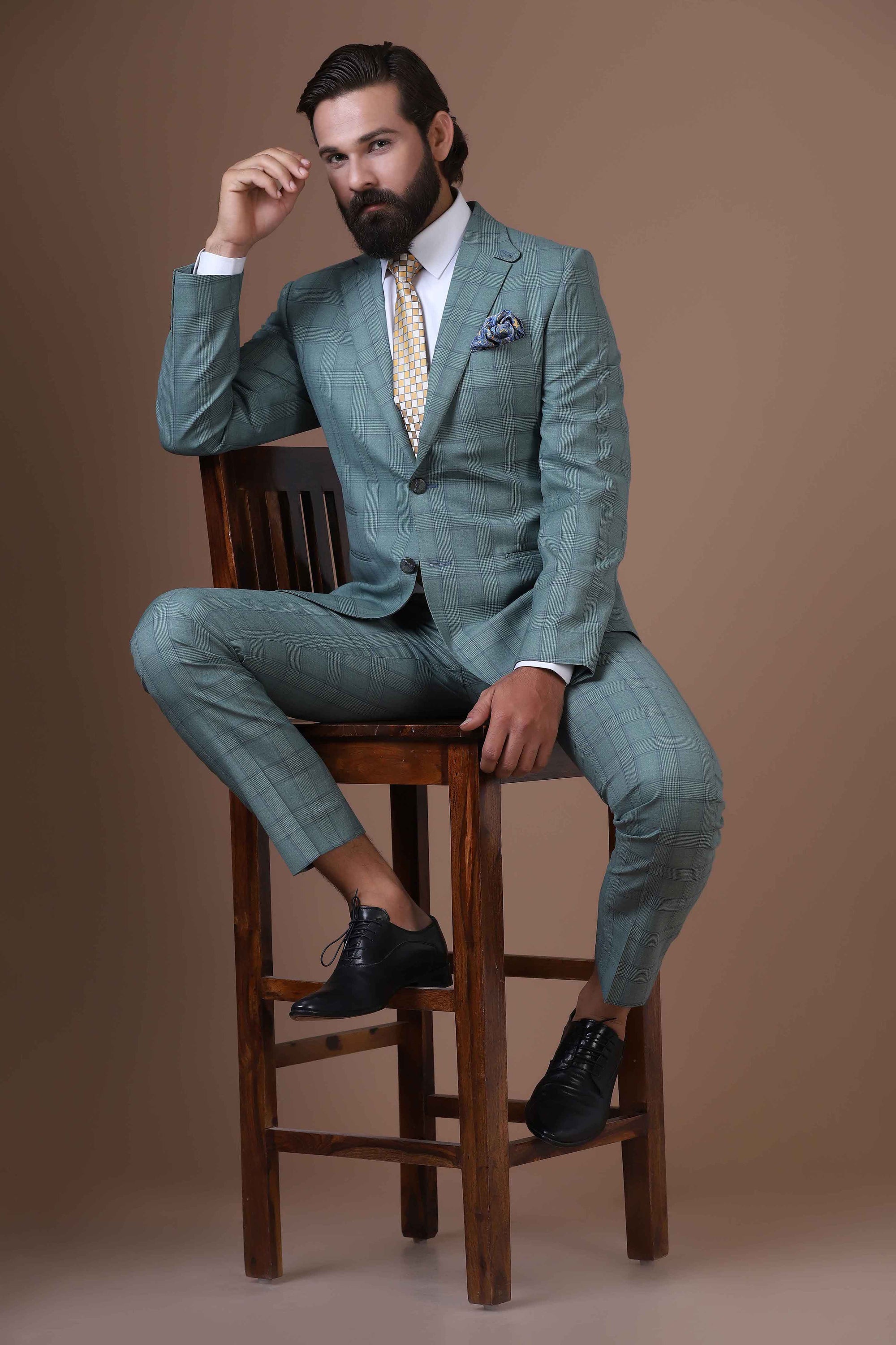 Elevate your ensemble with our two-button, notch lapel suit crafted from 100% wool fabric. Shop Now!