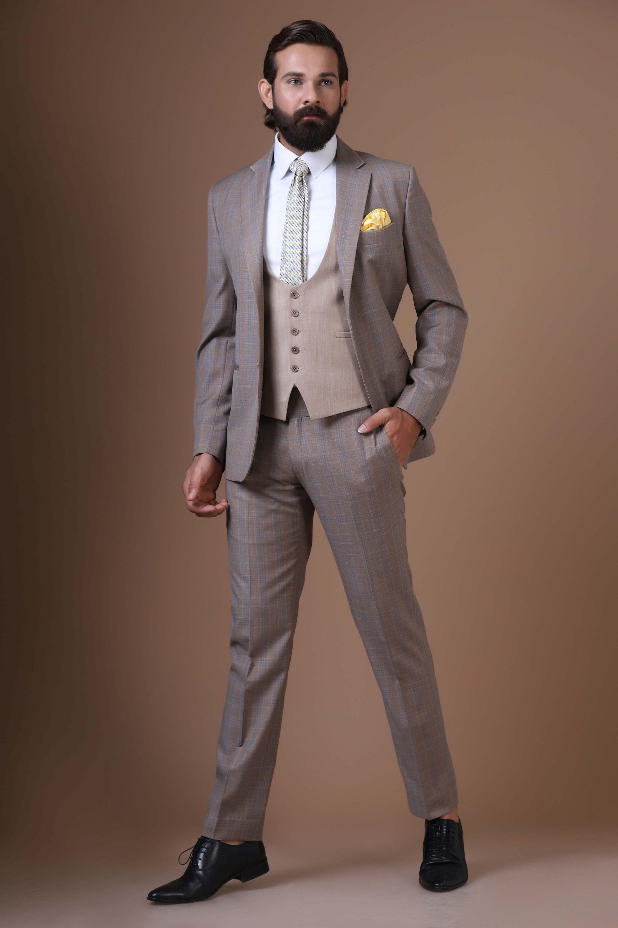 Step into sophistication with our Beige 3-Piece suit featuring a contrast waistcoat. Shop Now!